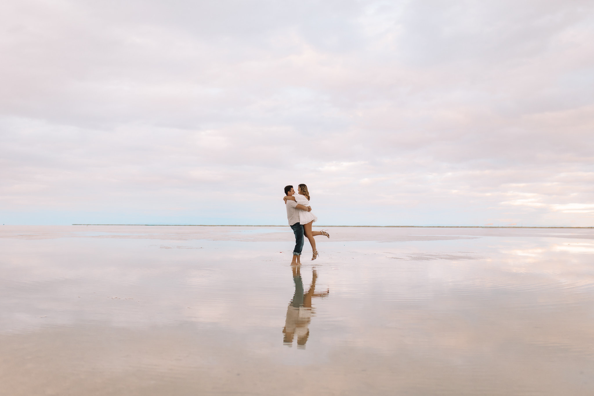 Salt Flats Elopement couple during blue hour, pink sky reflected in flooded flats