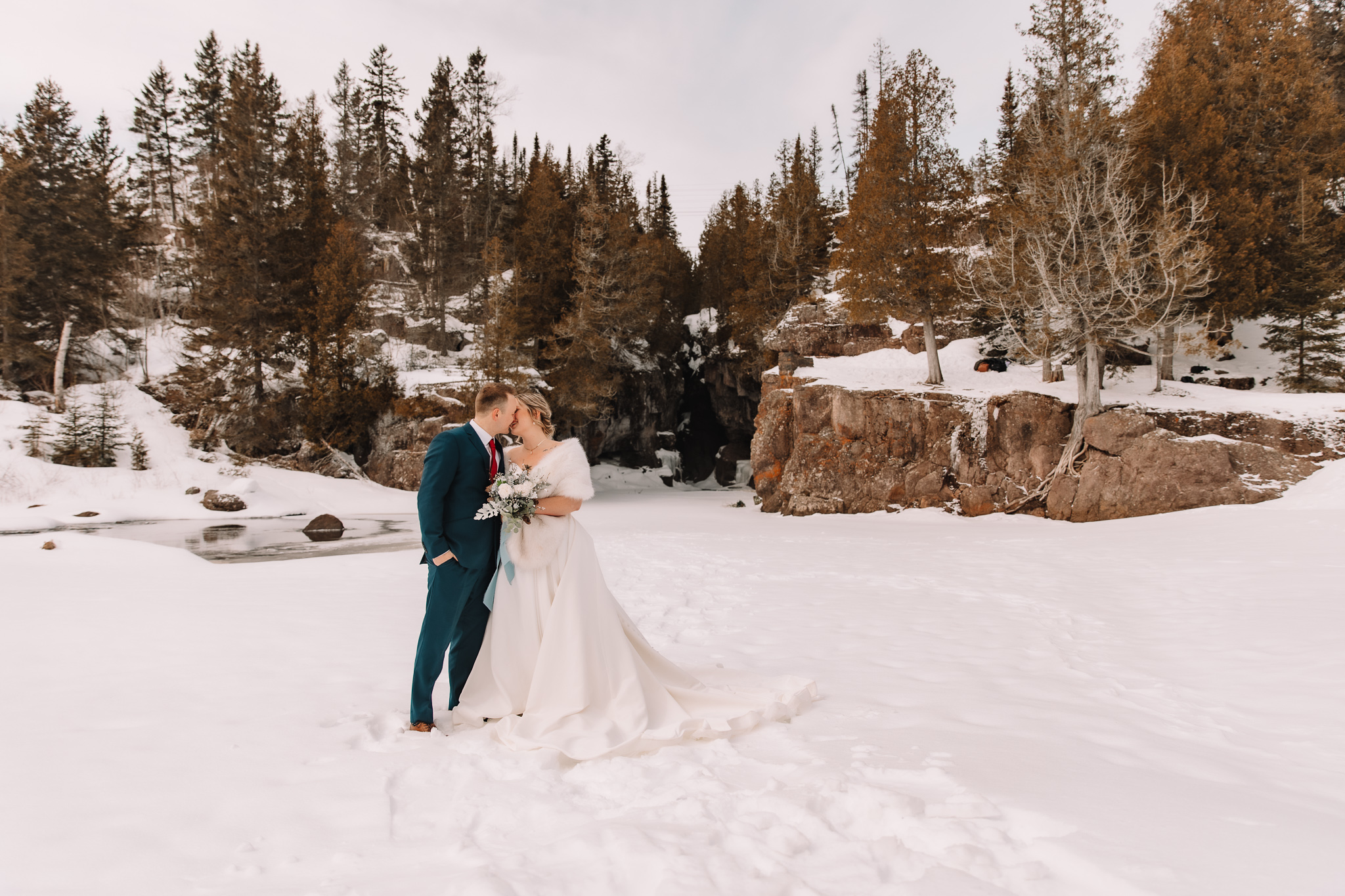 Wedding Couple getting married at Temperance River State Park in the Winter. 