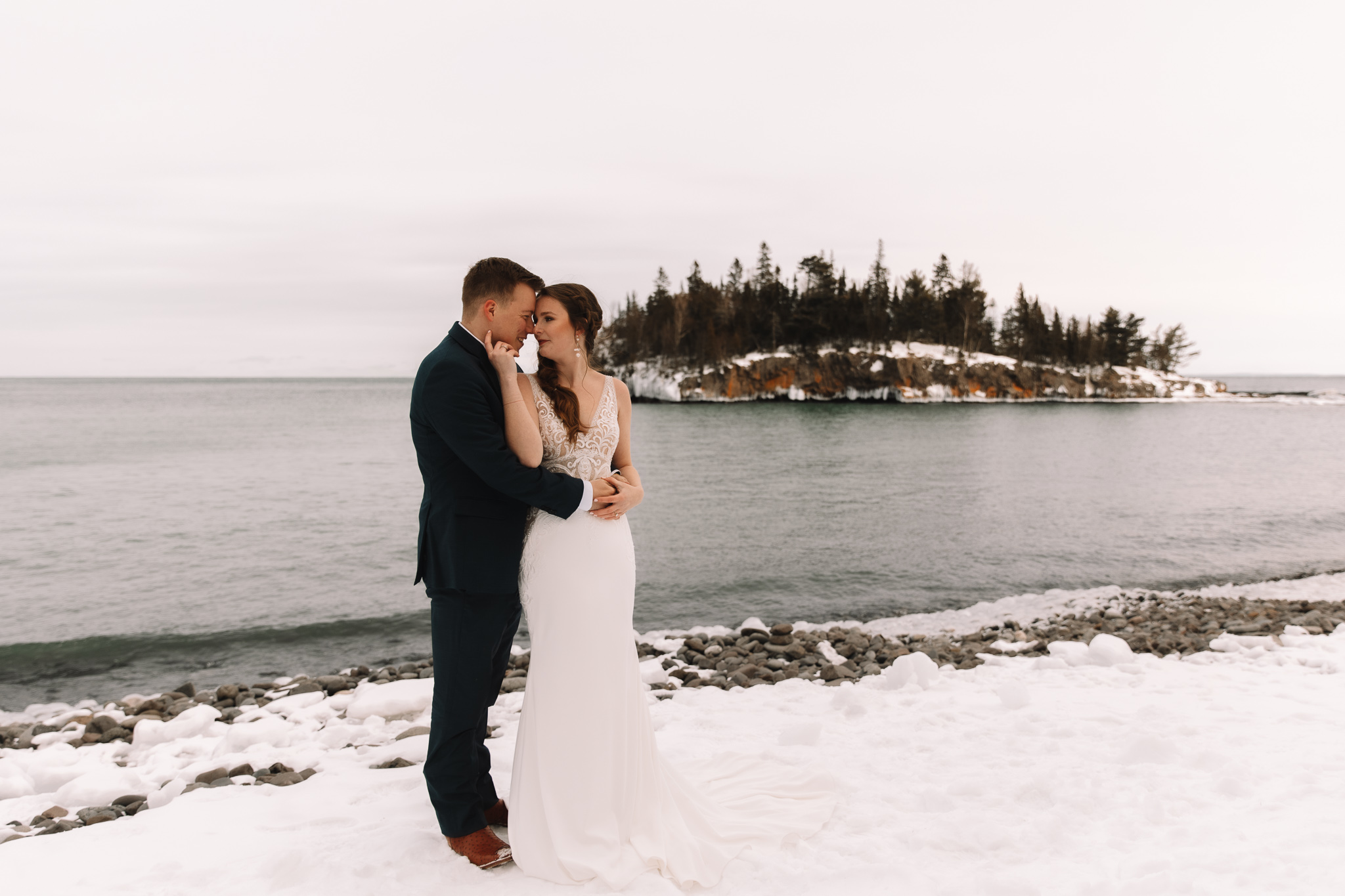 Elopement couple getting married at Silver Bay Beach in Minnesota on the North Shore