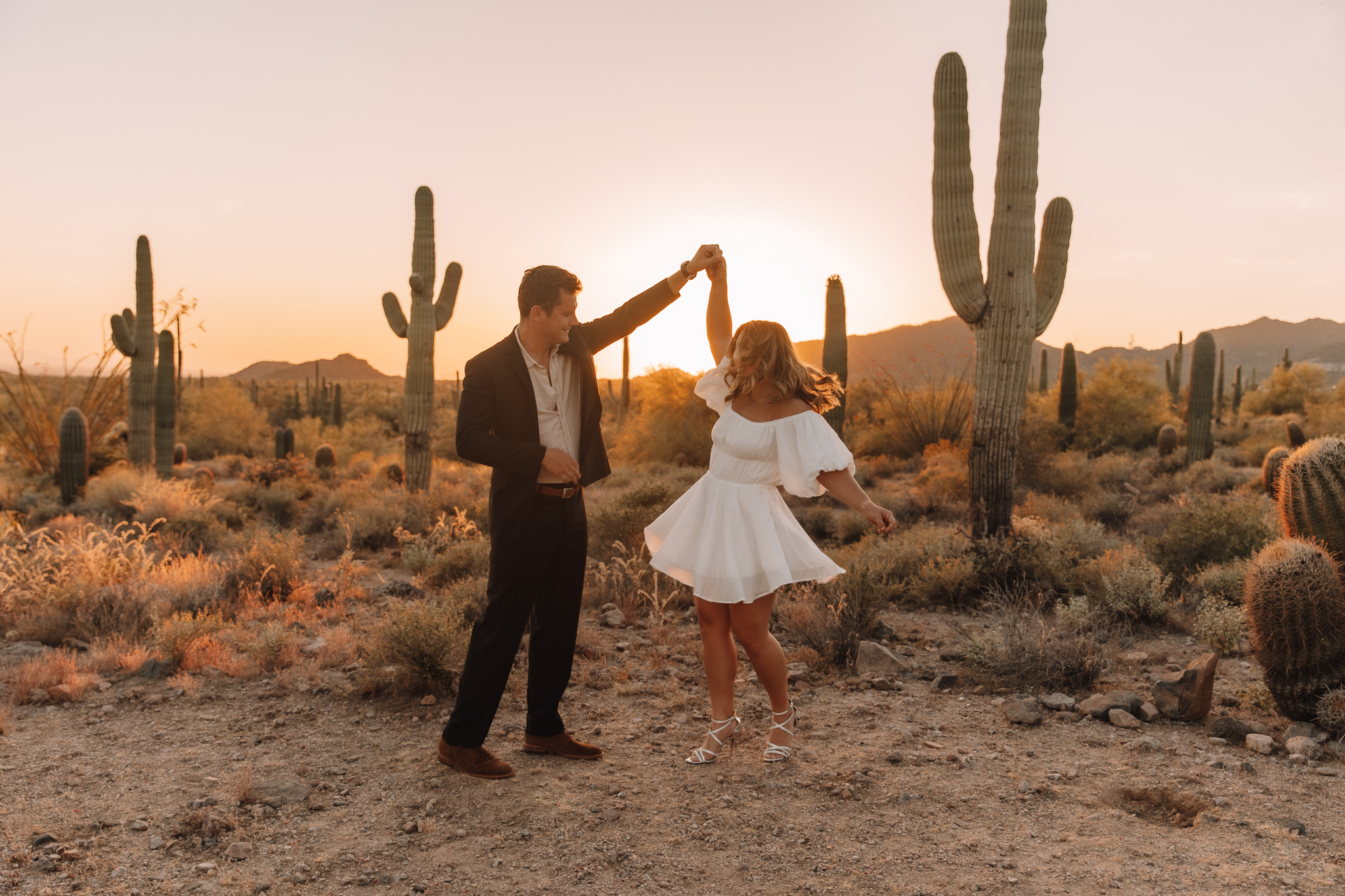 Elopement couple dancing in Arizona during sunset