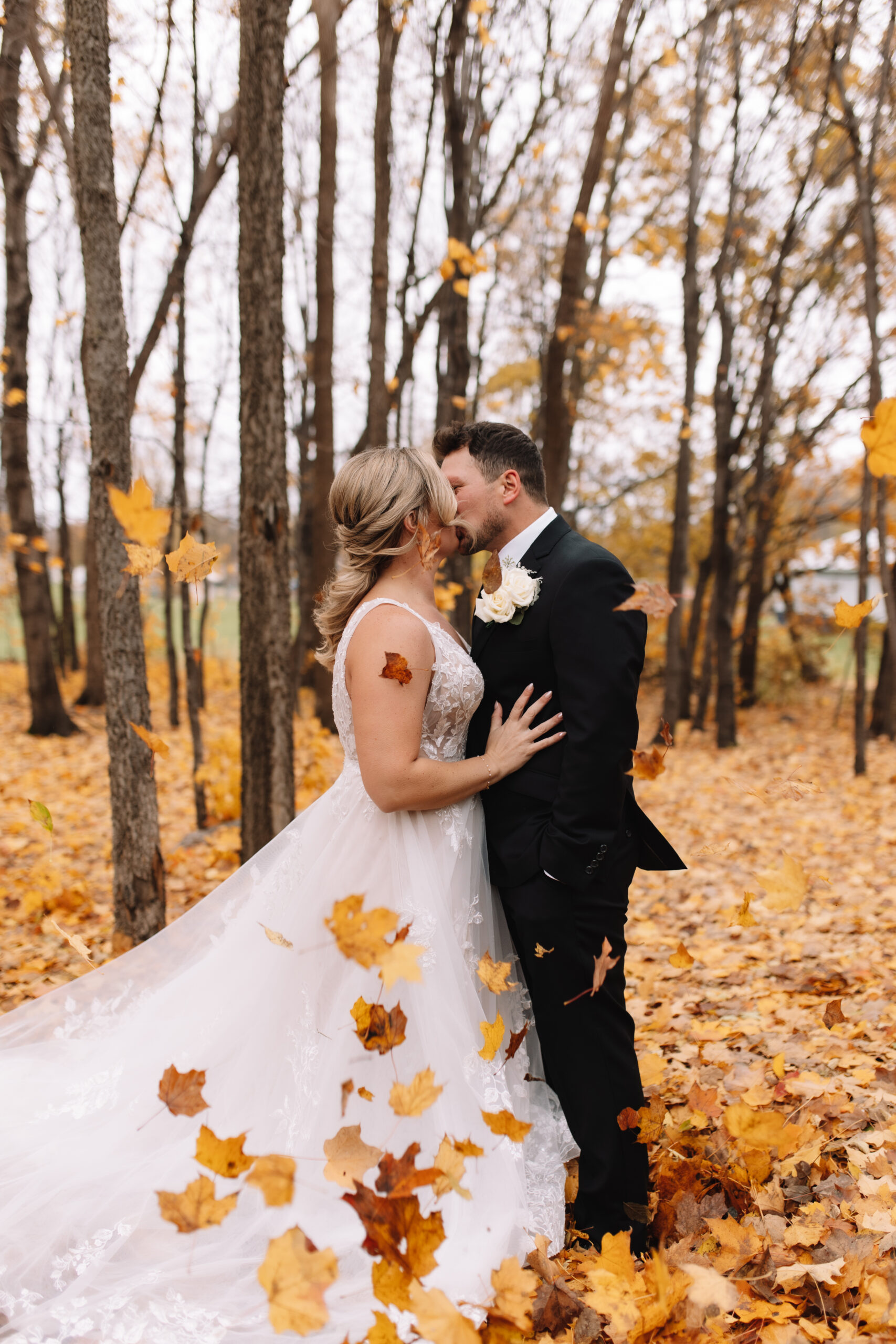 Bride and Groom Portraits at Ahavah Cottage Wedding venue in the fall leaves
