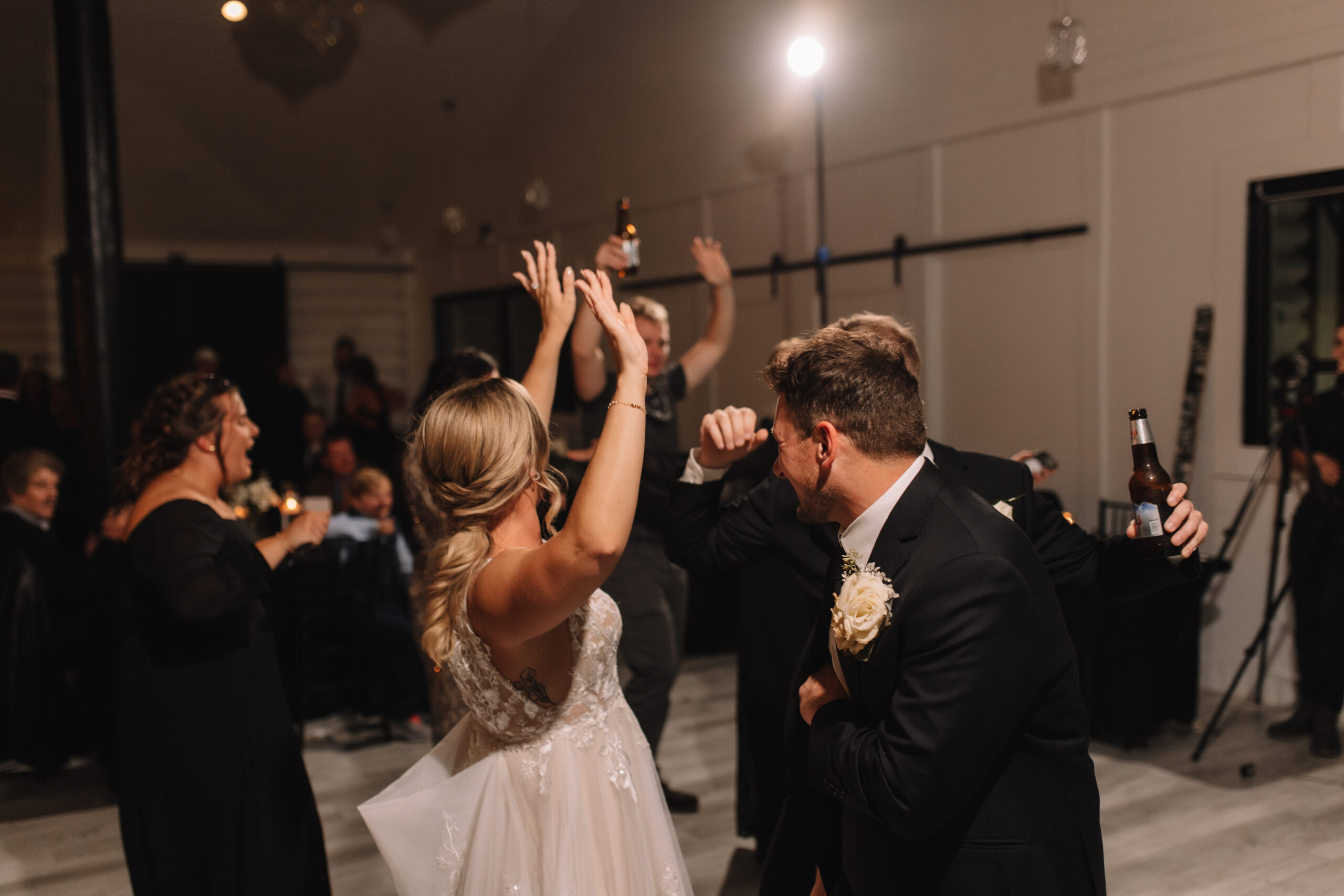 Bride and Groom Dancing together on the dance floor with guests