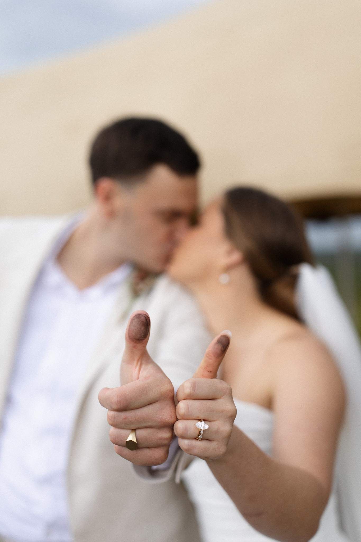 Newlyweds showing the inked thumbprints used during their legal wedding ceremony in South Africa
