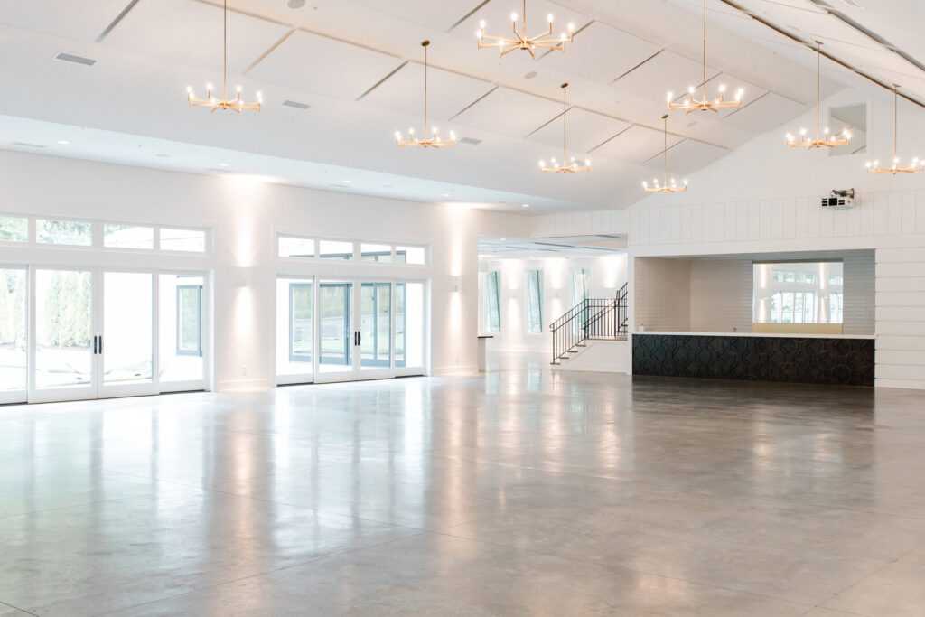 Beautiful spacious open plan indoor ceremony and reception space with large windows and tons of natural light