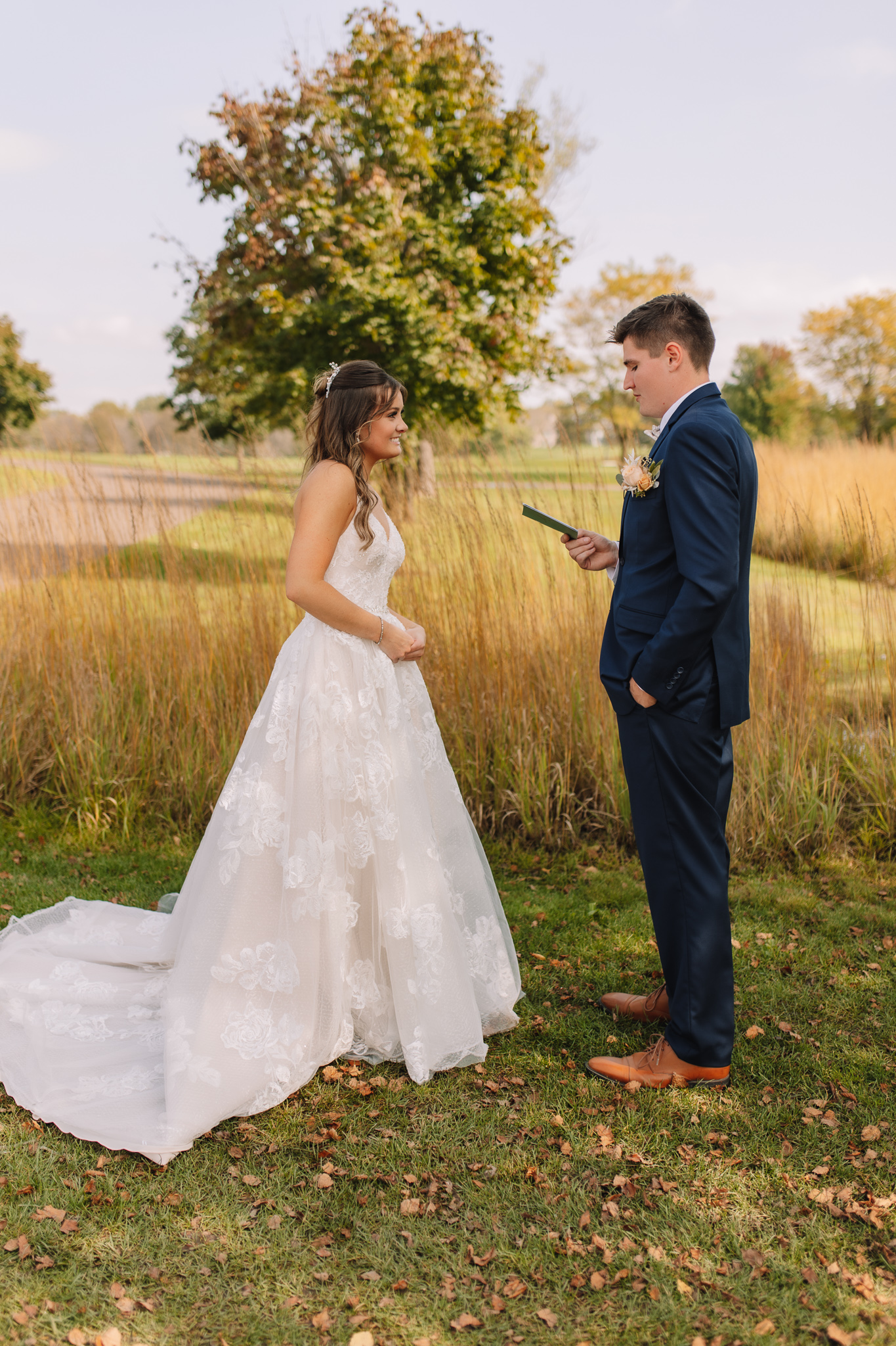 Bride and Groom exchanging personal vows during their first look on a golf course wedding venue in Minnesota