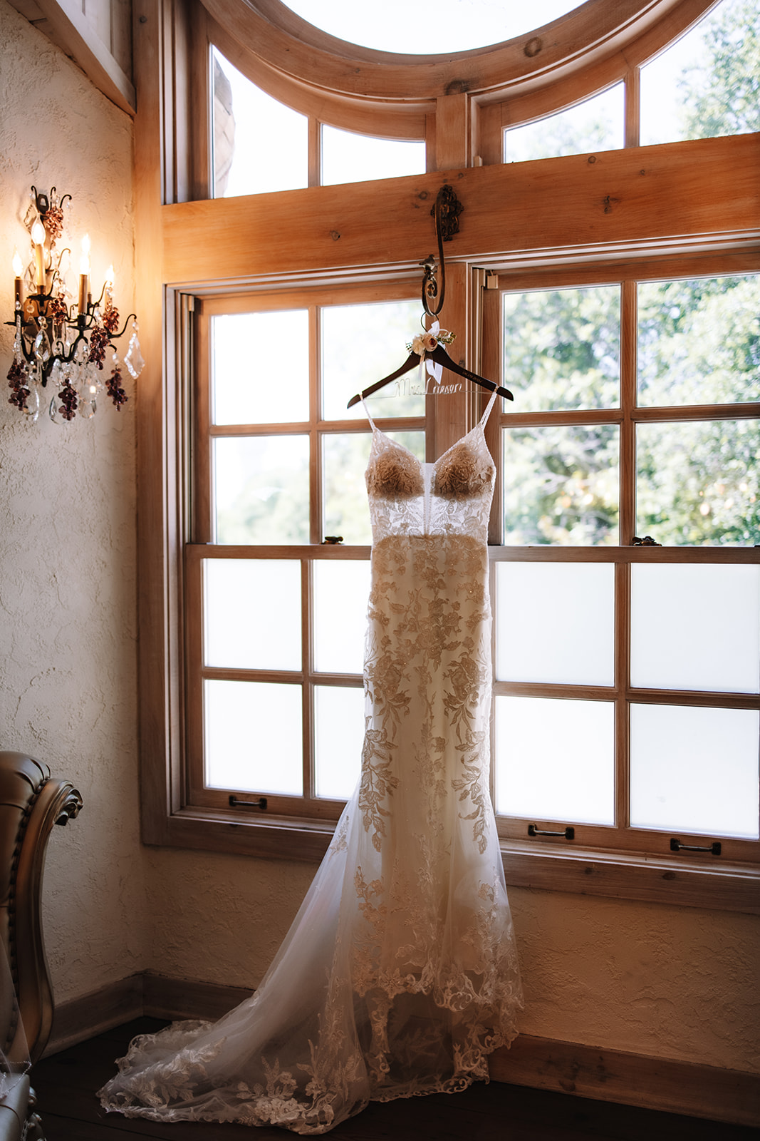 Bride lace white wedding dress hanging in the Bridal Suite at Edward Anne Estate