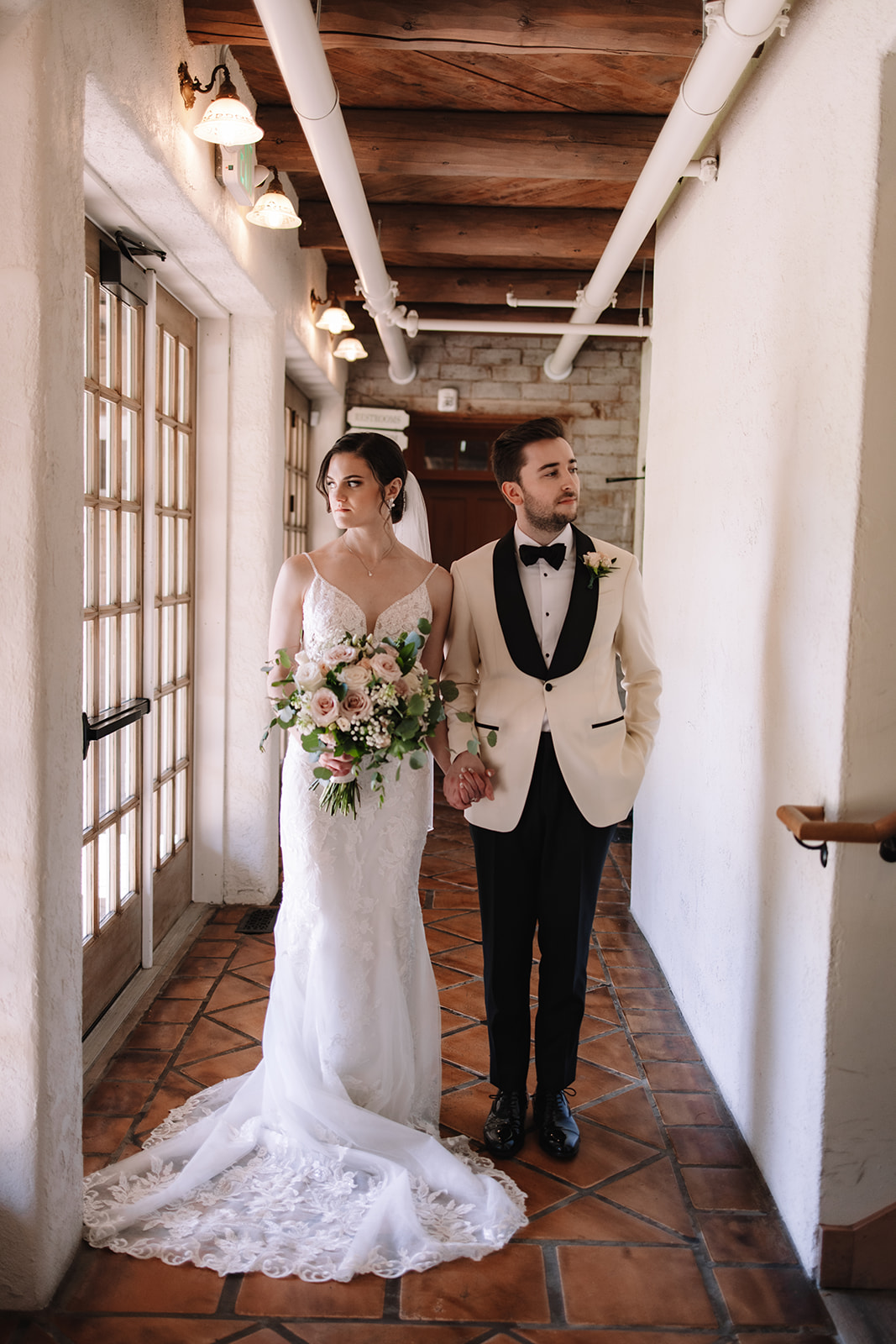 Bride and groom posing inside Edward Anne Estate