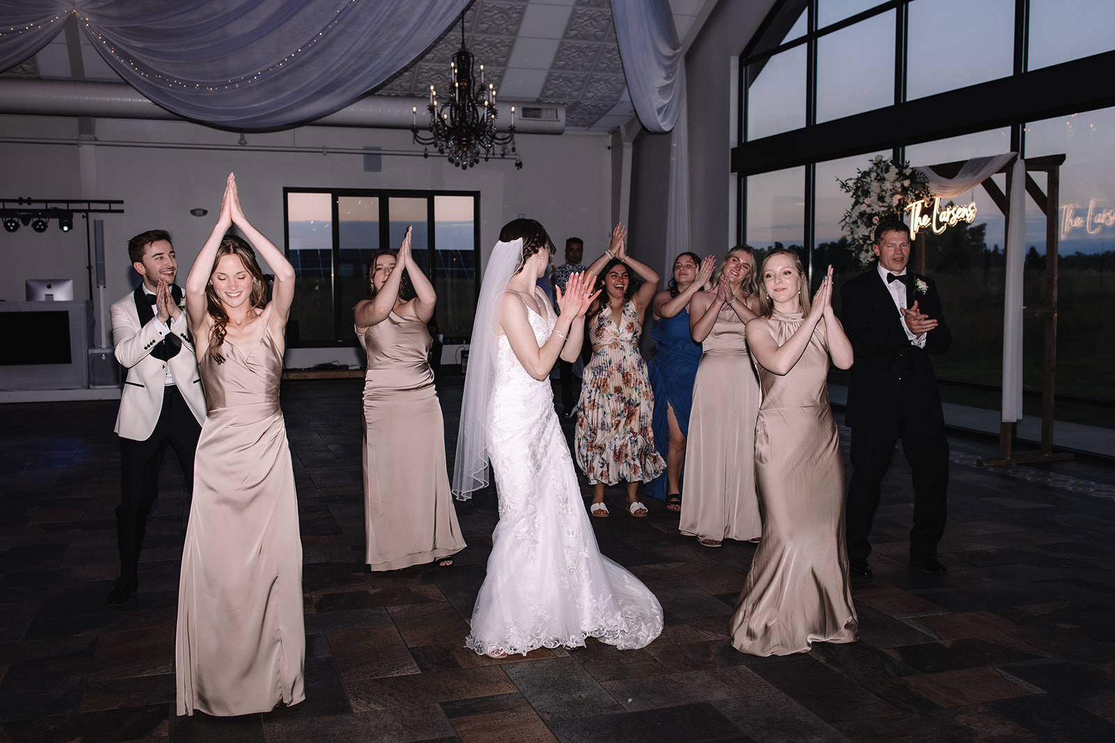 Bride dancing with bridesmaids on the dance floor