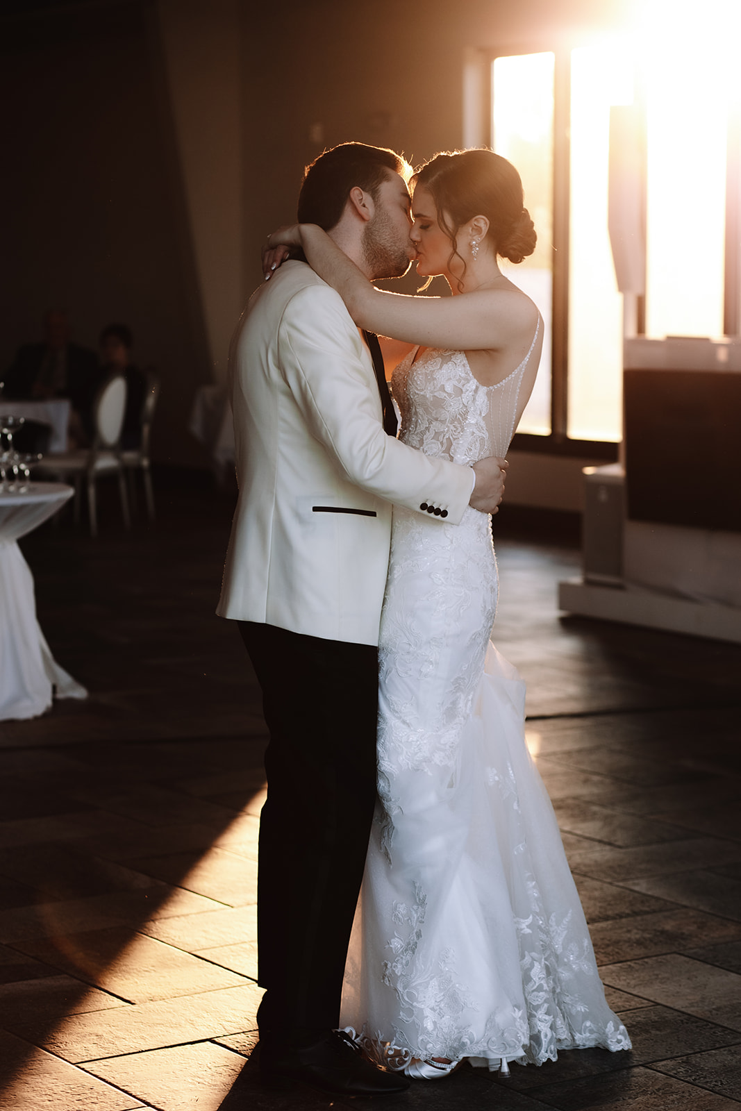 Bride and groom kissing during their first dance