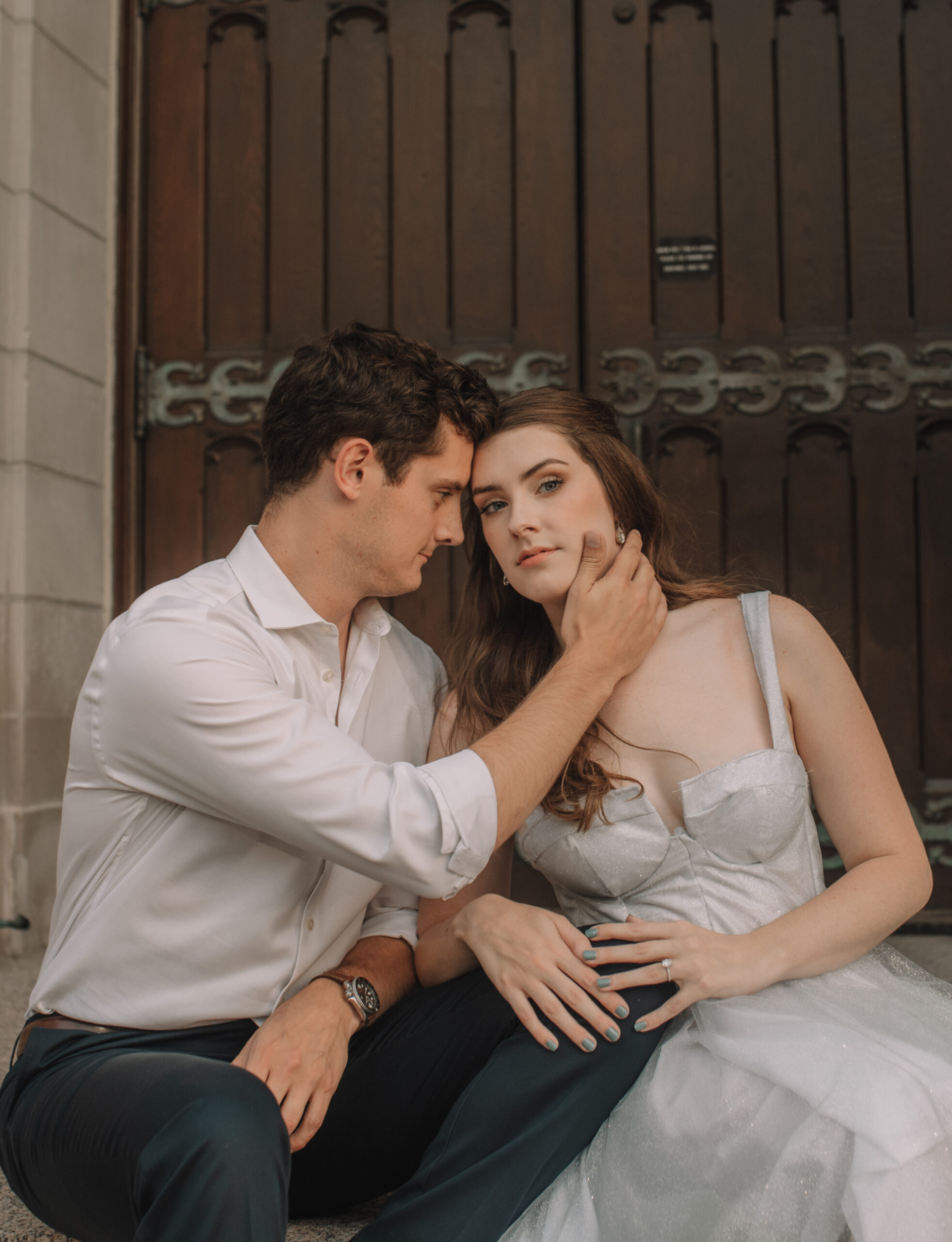 Newly engaged couple posing in front of the American Swedish Institute for their engagement photos