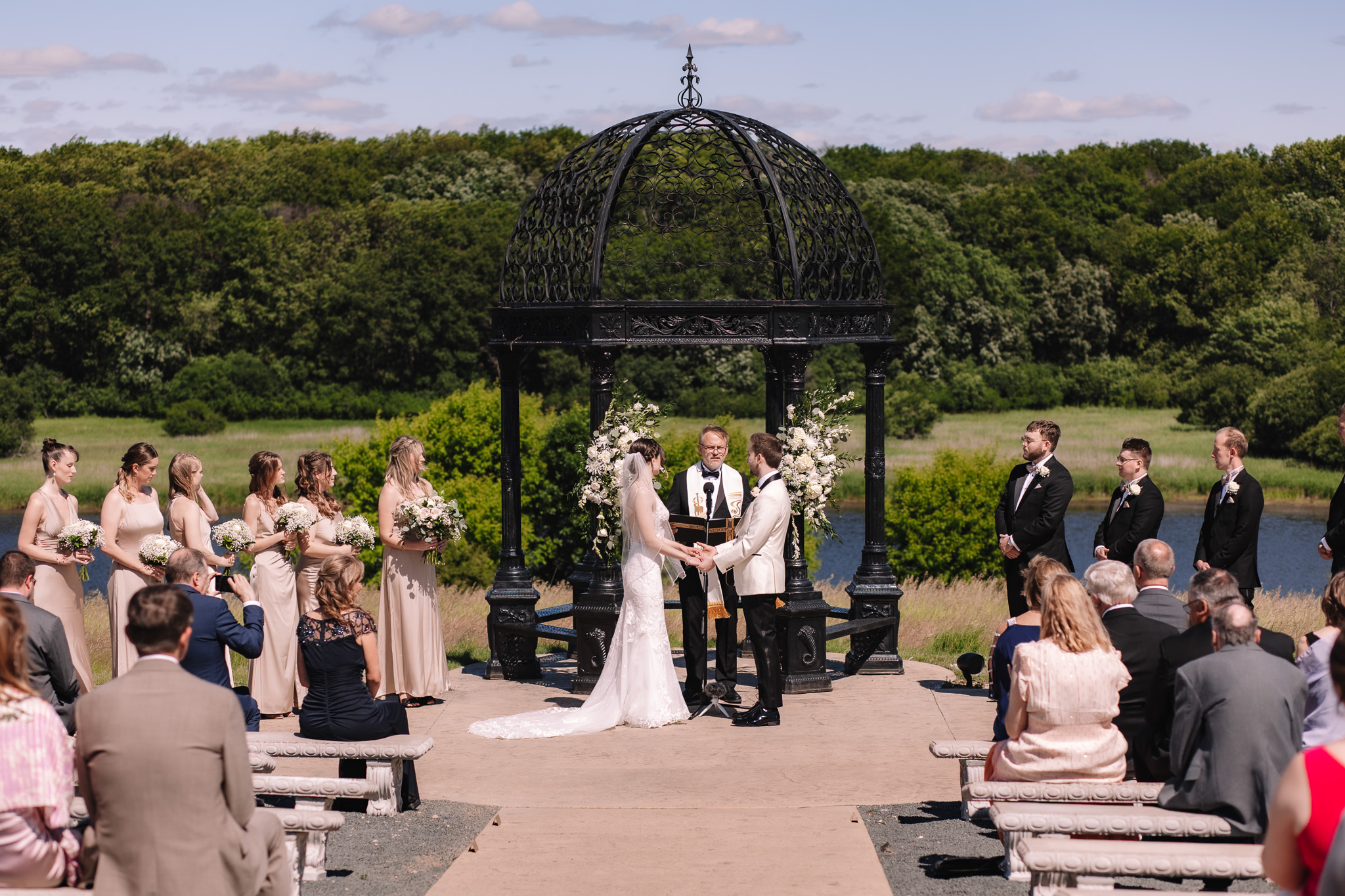 Bride and groom exchanging vows at Edward Anne Estate Wedding Venue in Minnesota