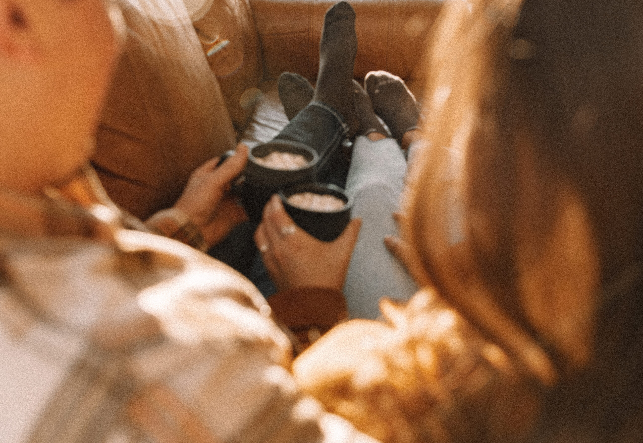 Newly engaged couple having hot chocolate indoors for their unique engagement photo locations in Minnesota