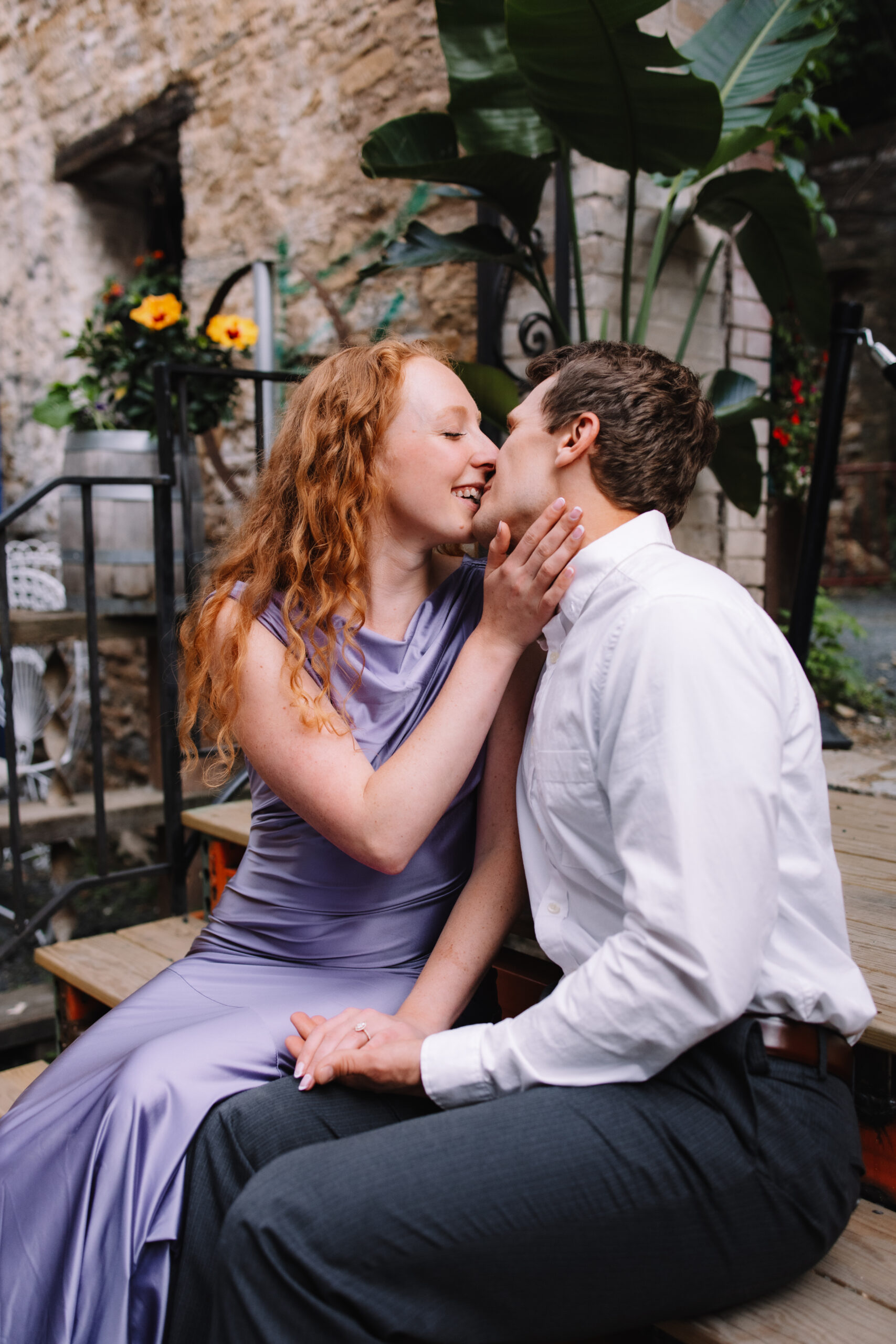 Newly engaged couple in fancy engagement outfits