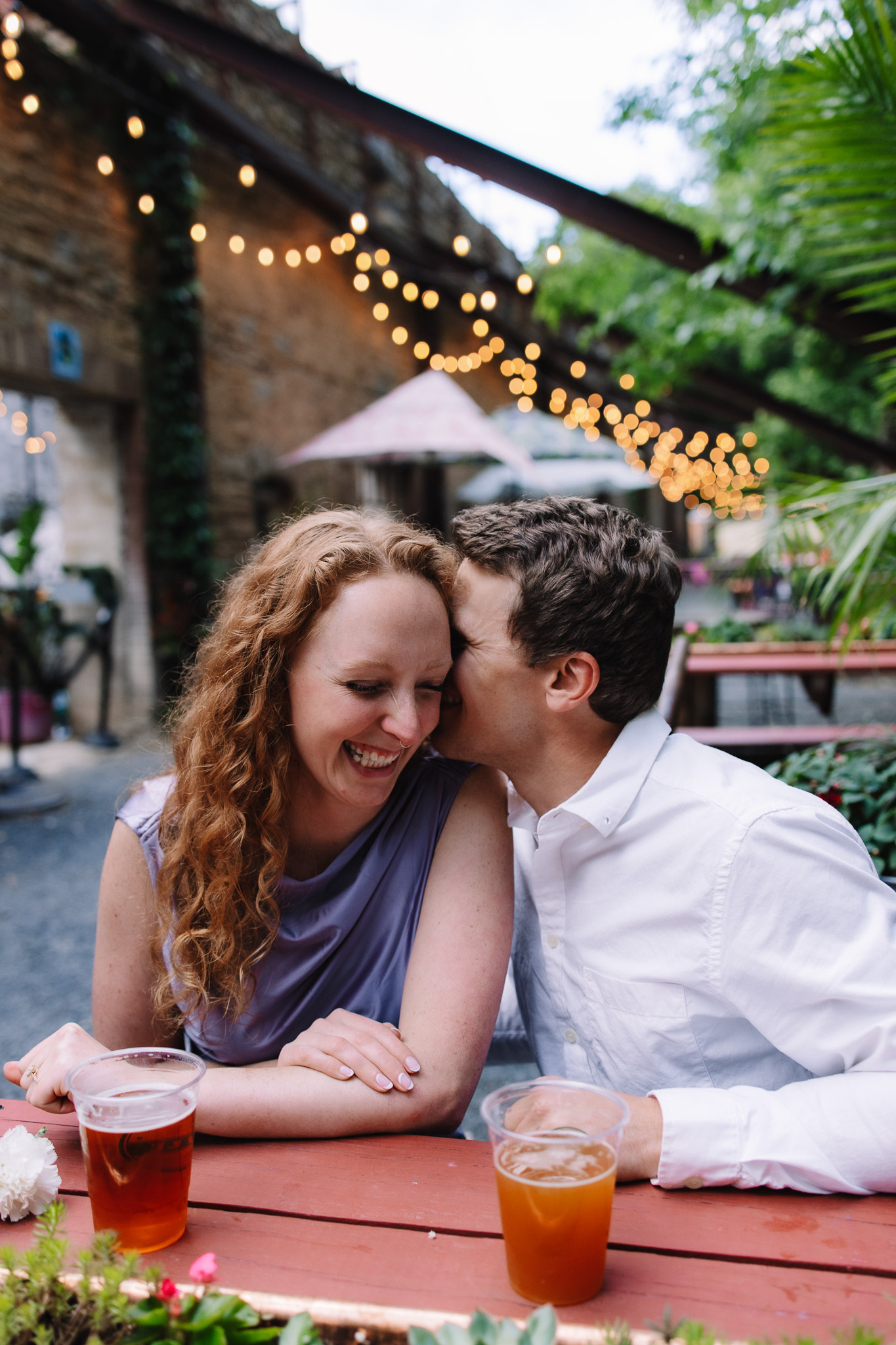 Newly engaged couple in fancy engagement outfits