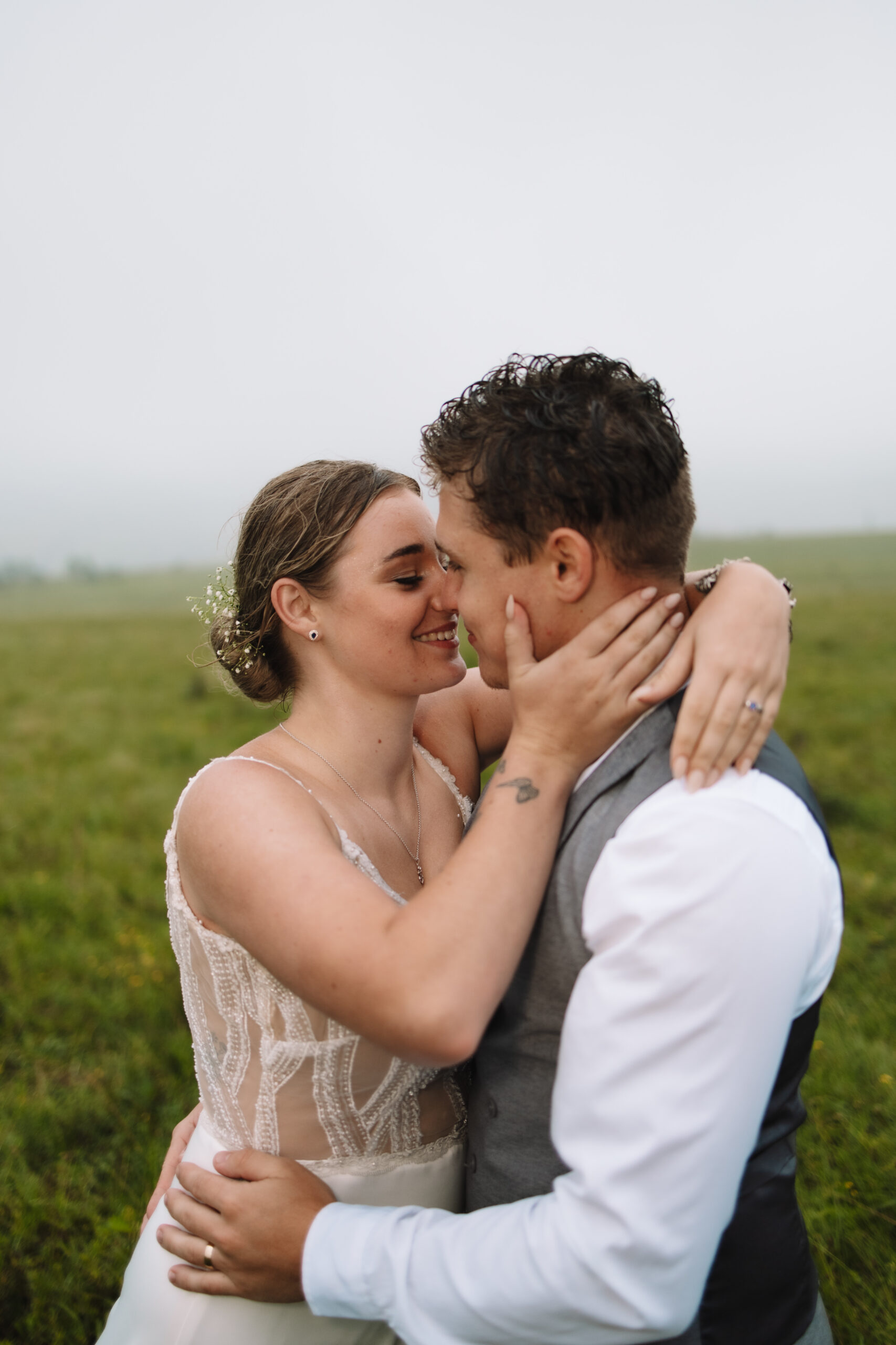 Bride and groom holding eachother while smiling during their destination wedding in South Africa