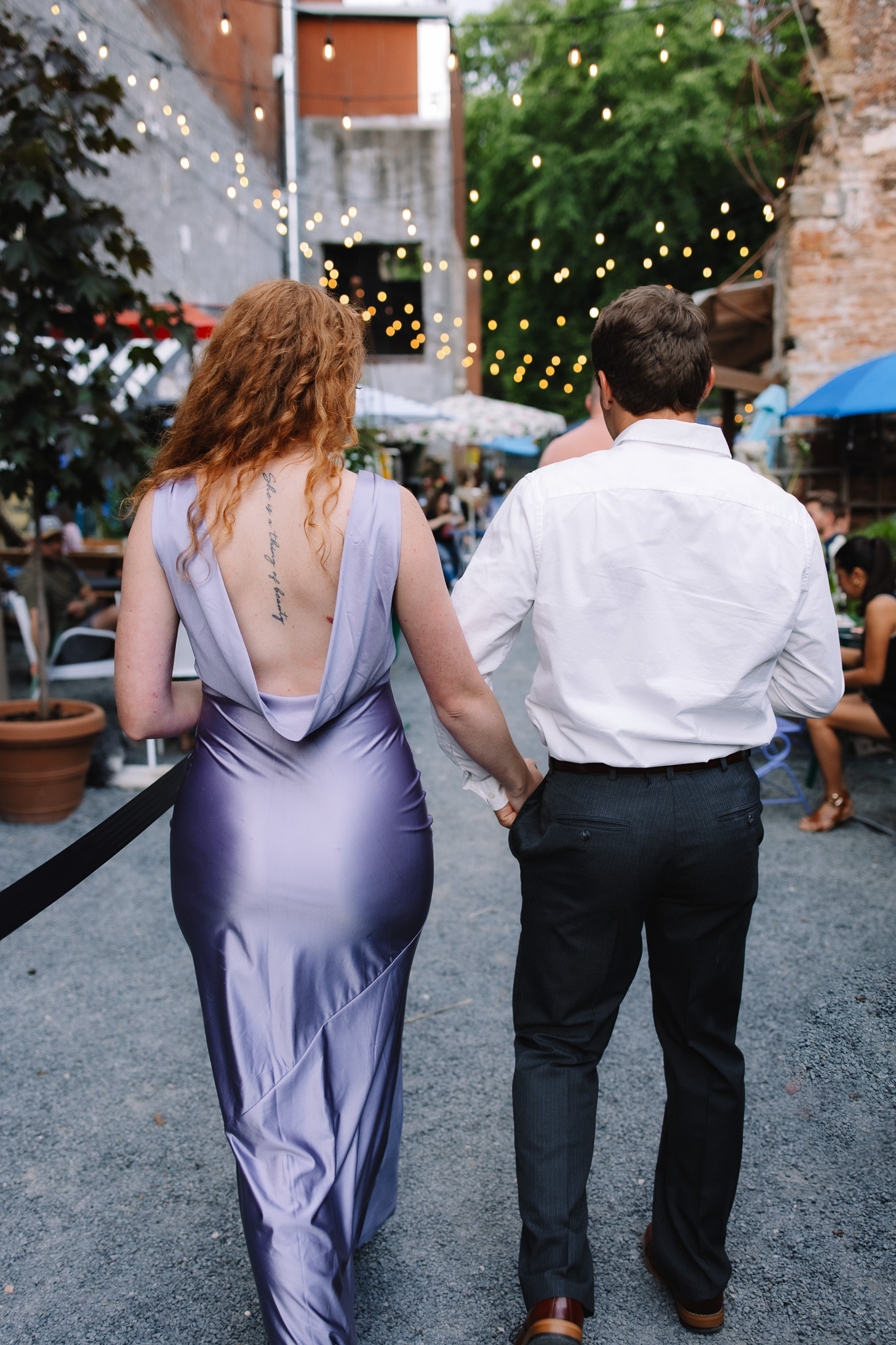 Newly engaged couple in fancy engagement outfits