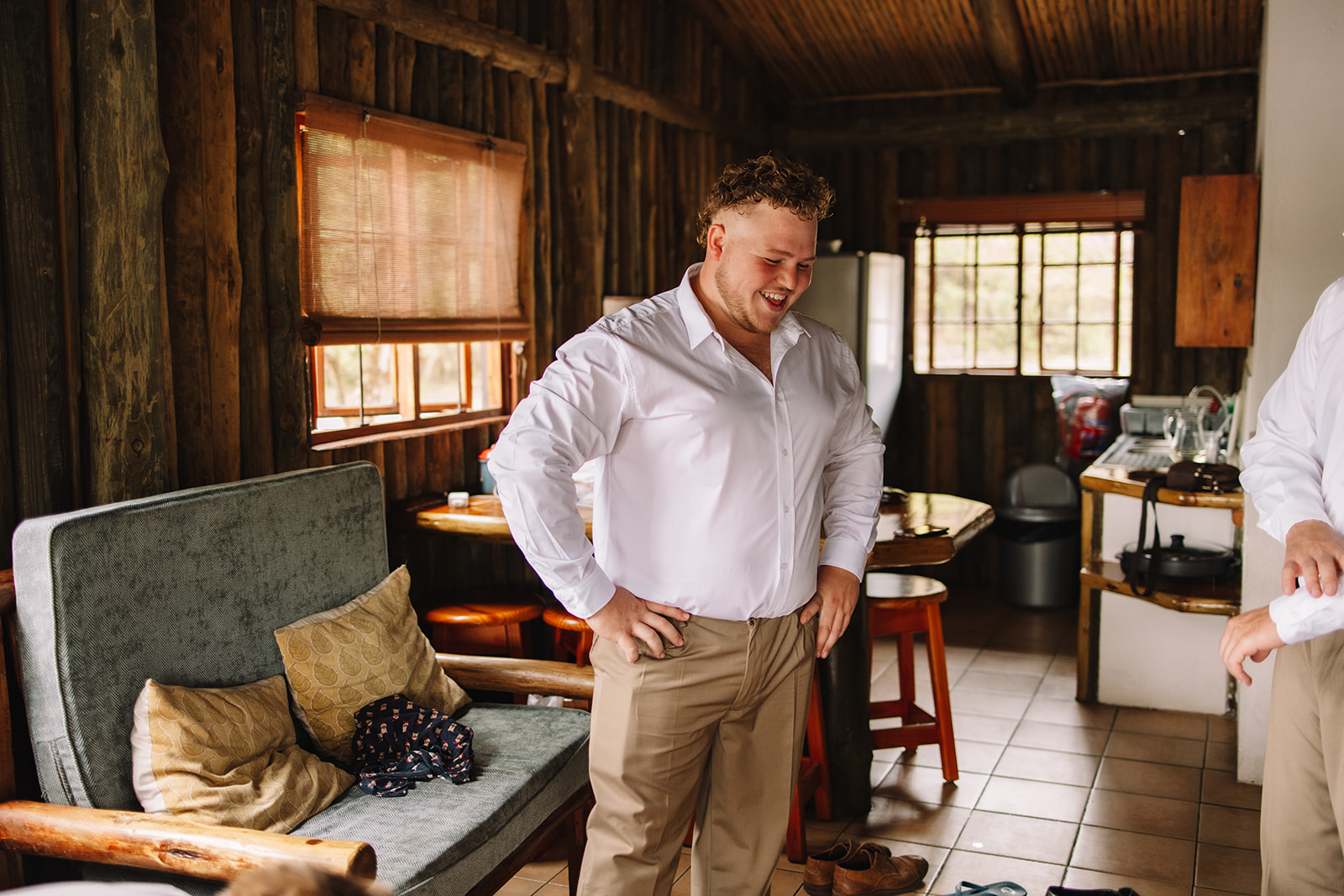 Groomsmen getting ready in a sleeper chalet at Lake Eland