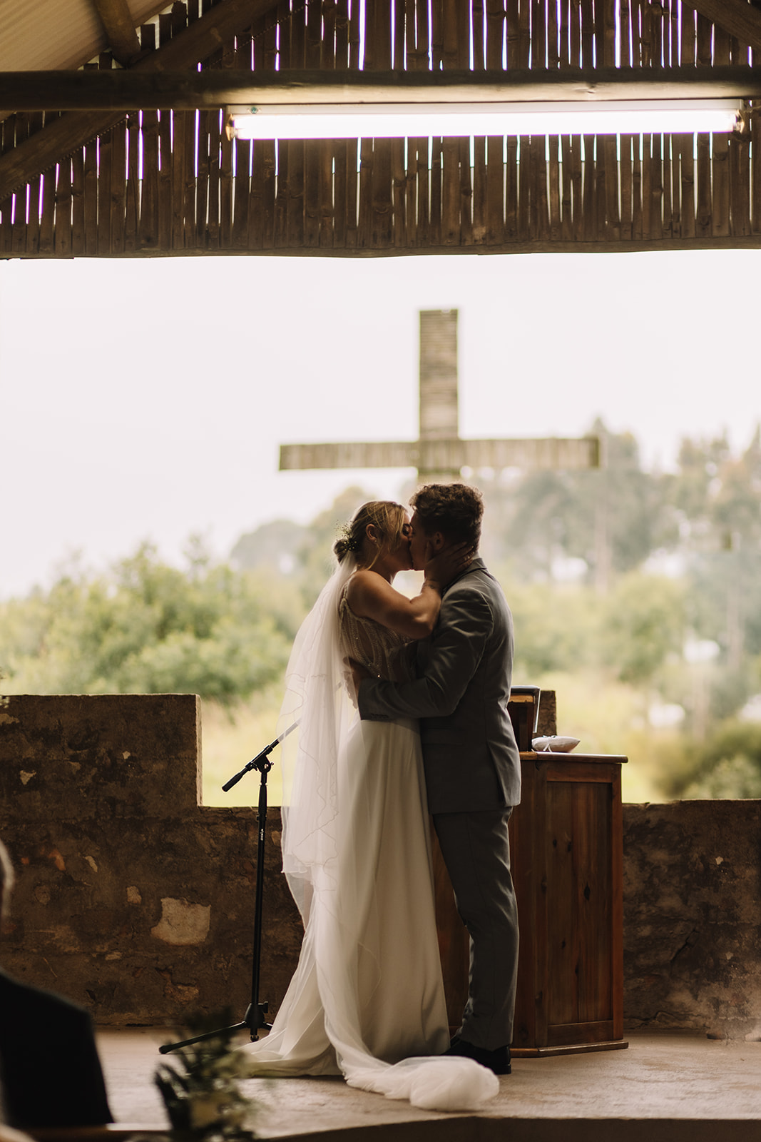 Bride and groom kissing after their wedding ceremony