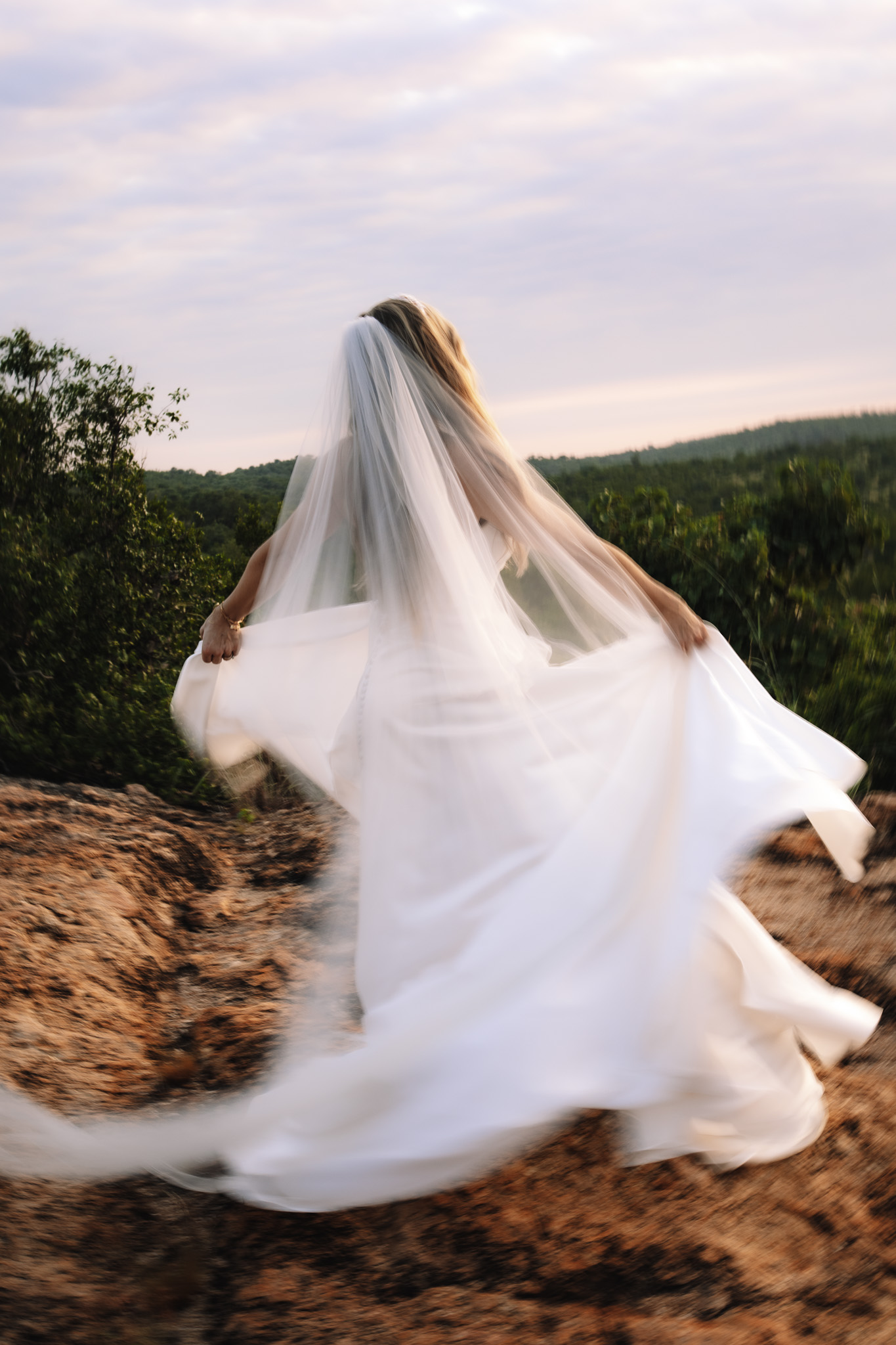 Bride twirling around in her beautiful wedding dress on her safari wedding in South Africa