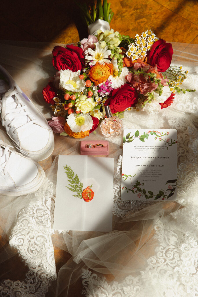 Colorful summer wedding flat lay detail at The Basilica of St. Mary Church in Minneapolis