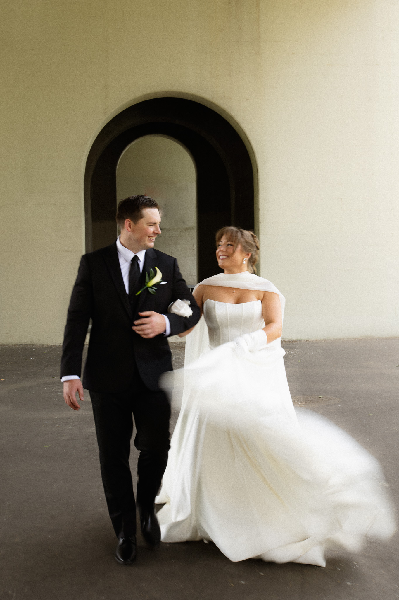 Bride and groom walking through Nicollet Island near The View, Minneapolis Event Centers
