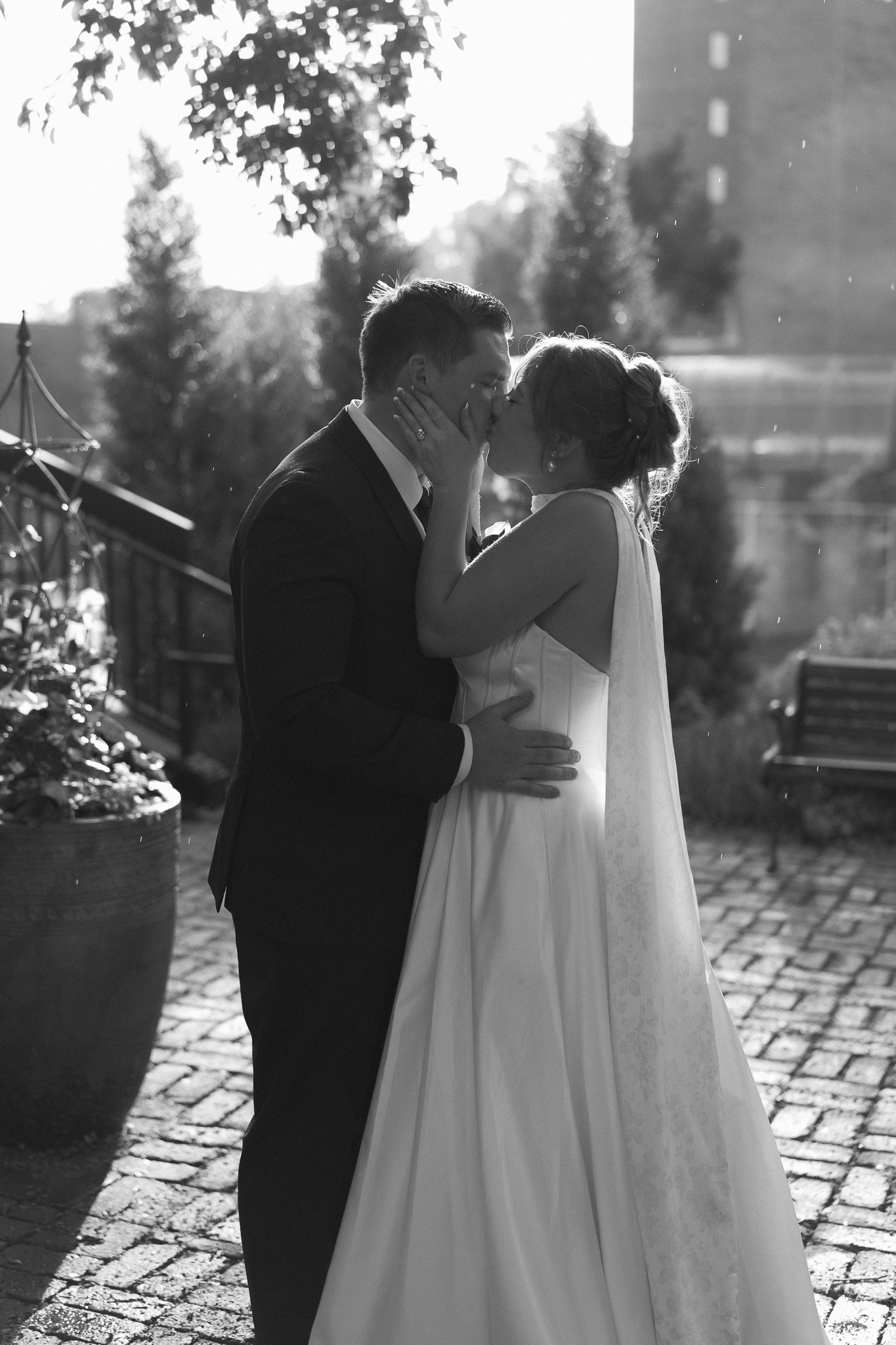 Bride and Groom portrait kissing in the rain at The View Minneapolis Event Centers