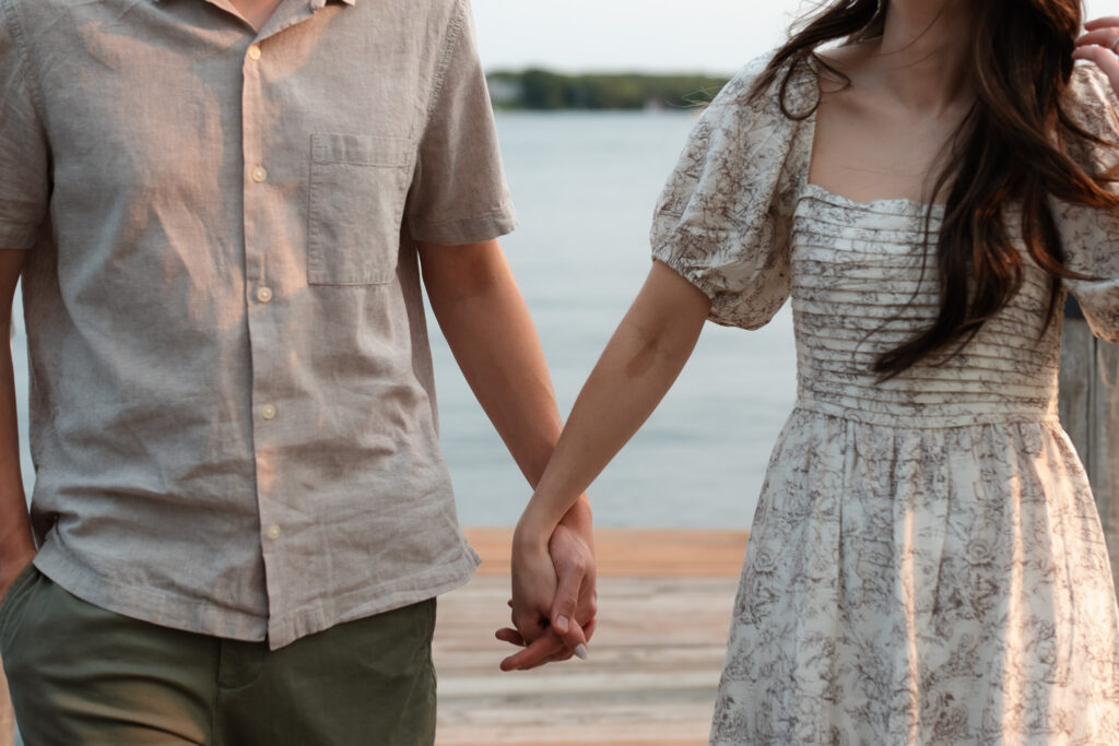 Wayzata engagement photos of stunning couple holding hands