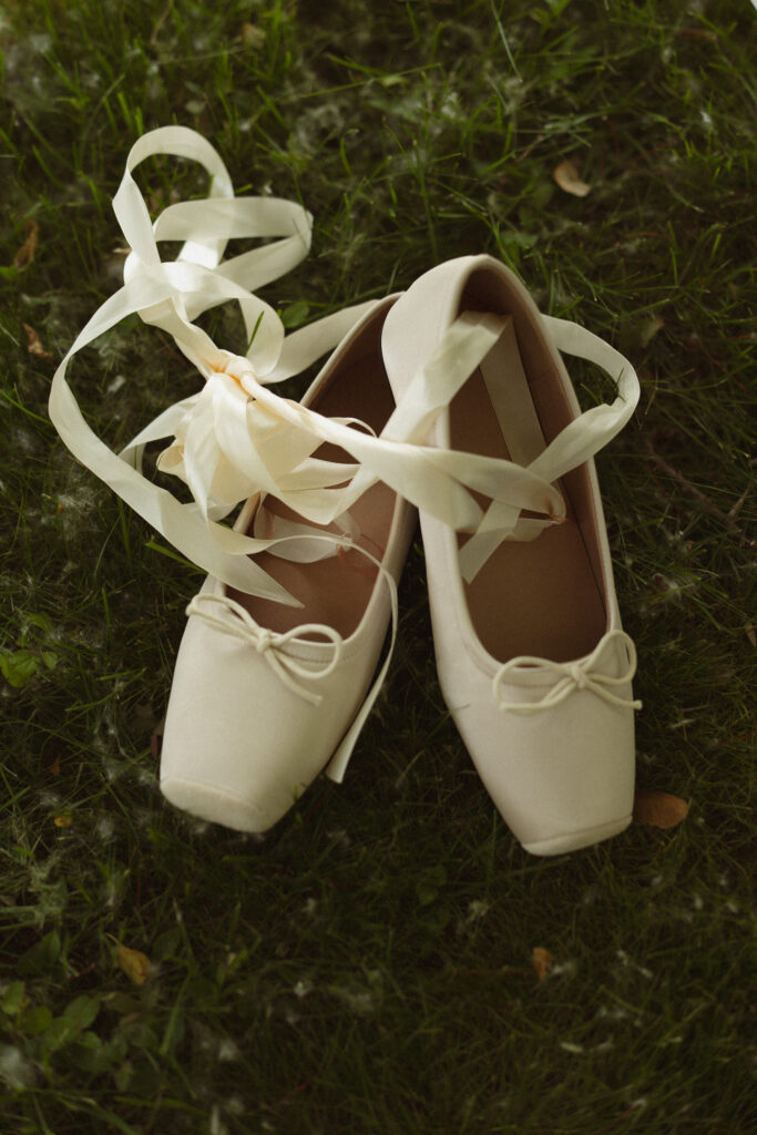 Detail shot of Bridal shoes that look like Ballet shoes