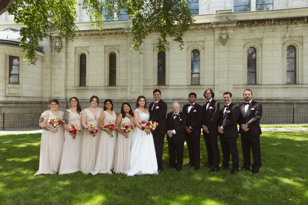 Group photo of the Wedding Party after a ceremony at The Basilica of St. Mary church in Minneapolis