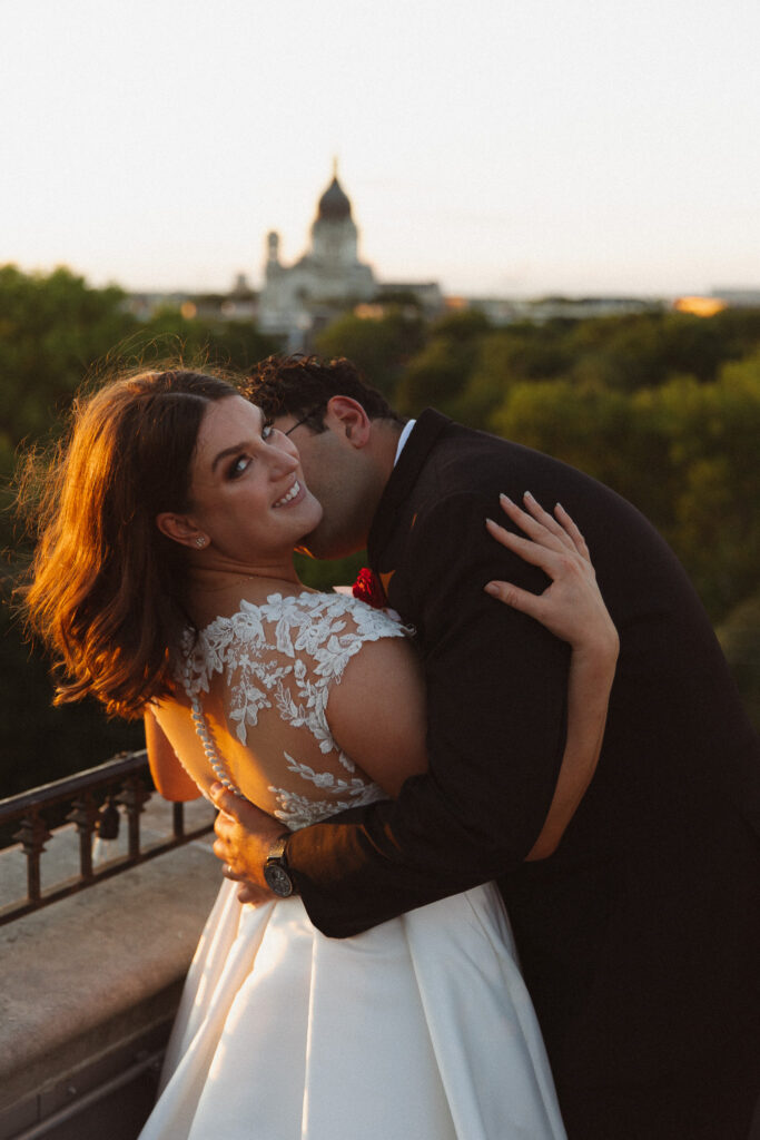 Bride and groom sunset portrait on the top of the balcony at The Women's Club for their wedding at The Basilica of St Mary in Minneapolis