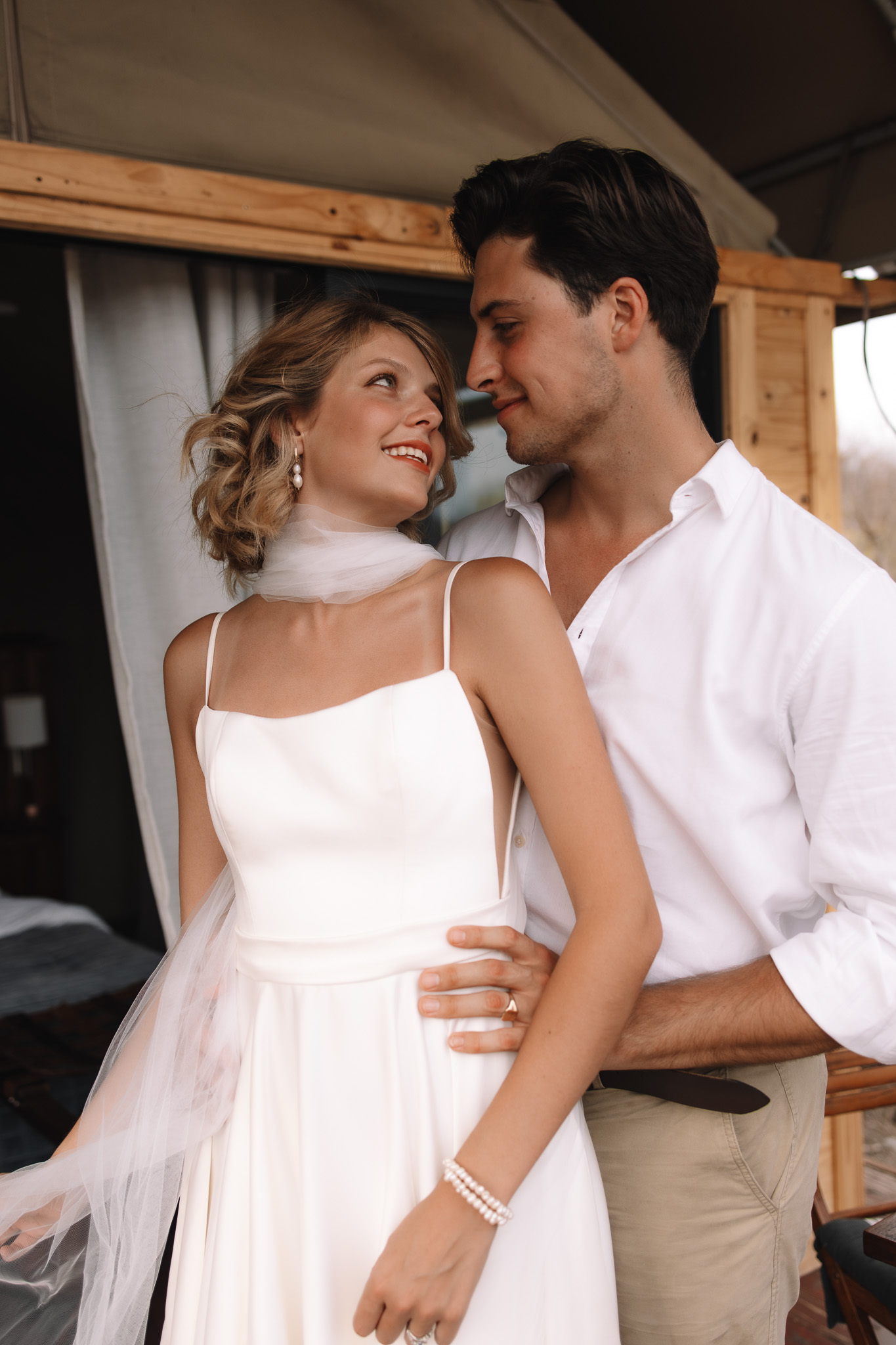 Bride and groom getting ready together in their private safari room