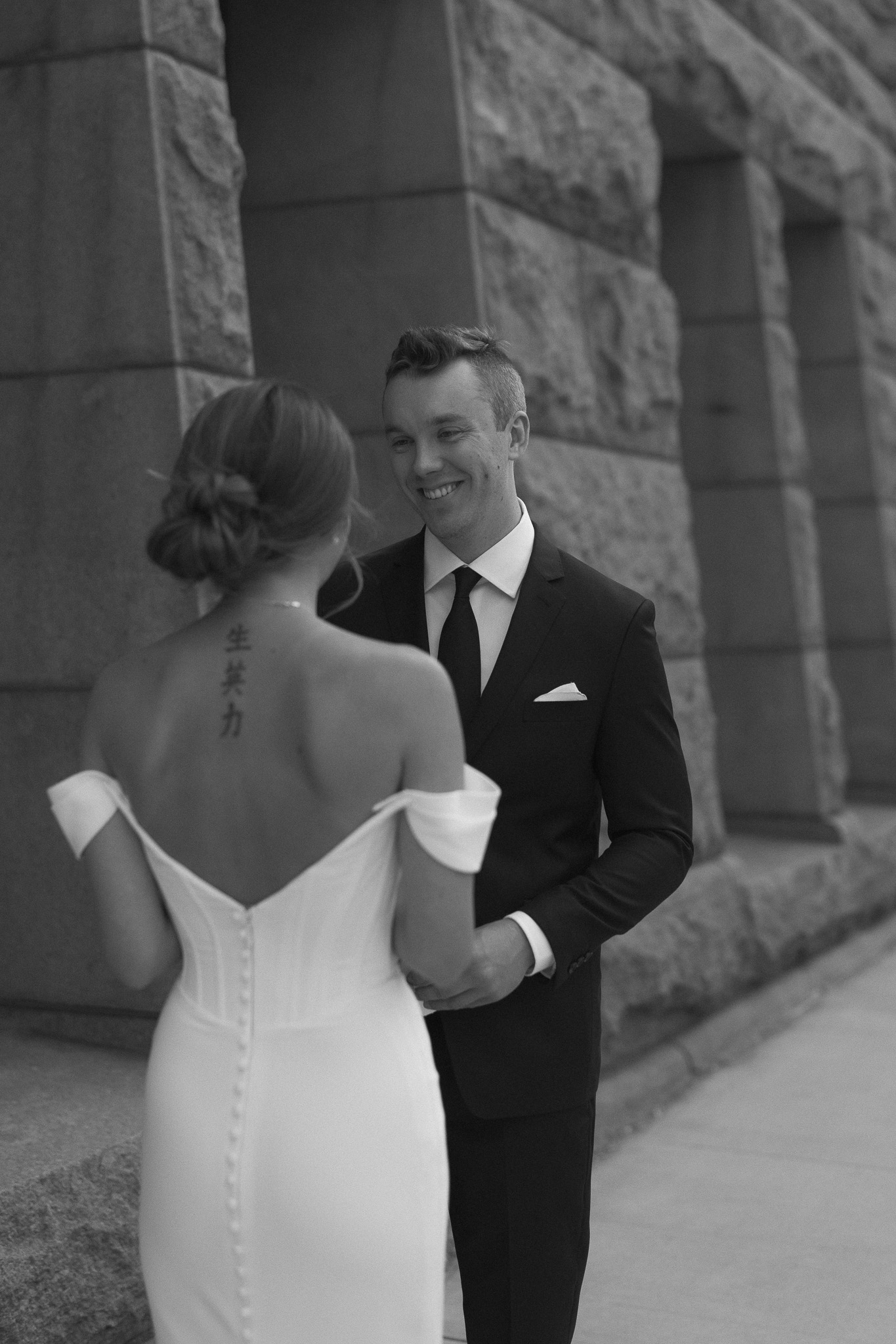 Groom admiring his bride during their first look