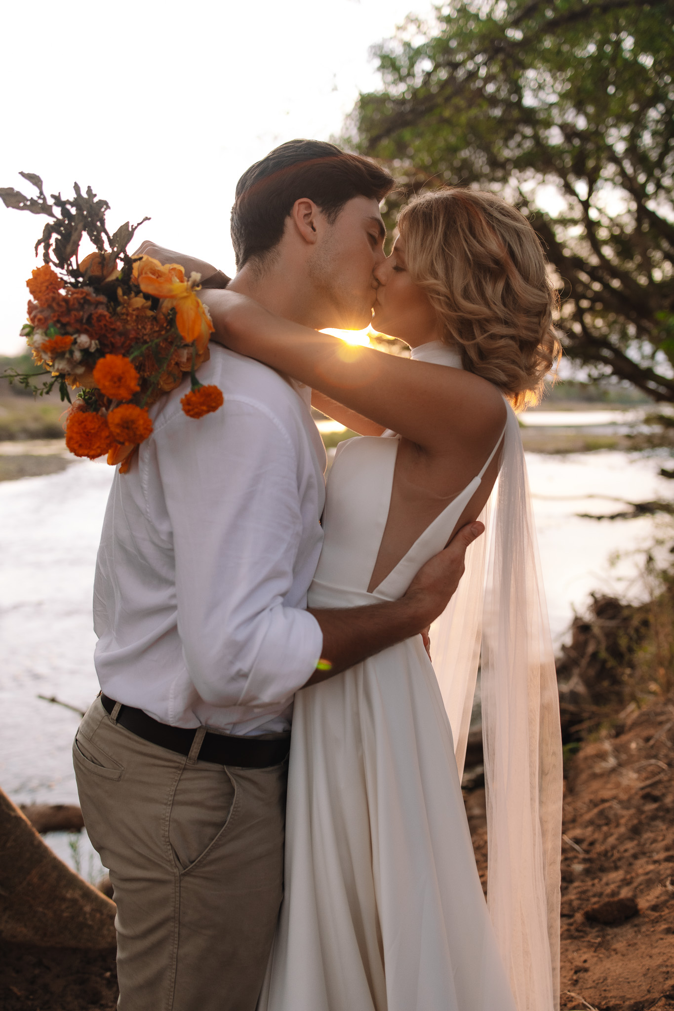 Couple during golden hour on a safari game drive in Sabi Sands captured by South Africa safari elopement photographer