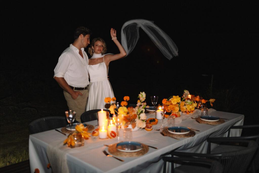 South Africa safari elopement photographer captures couple during their intimate private dinner after their elopement ceremony and priavte vows