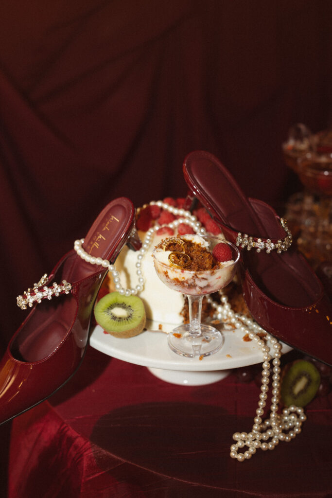 Messy late night trendy detail photo of wedding shoes and carrot cake