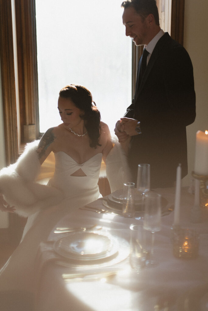 Bride and groom at the reception together during their wedding at The Hutton House