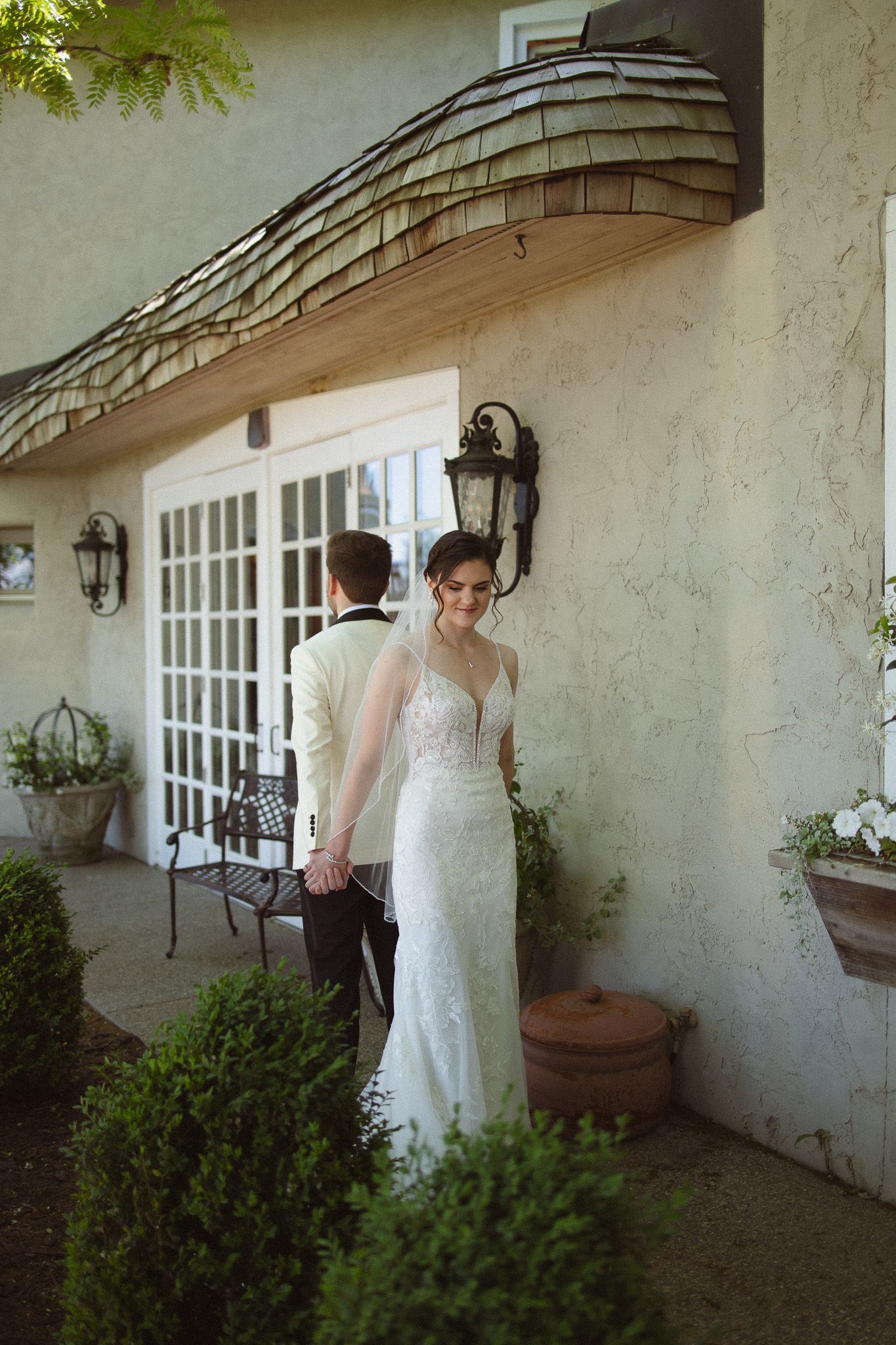 Bride and Groom having their first touch outside the Edward Anne Estate at Bavaria Downs
