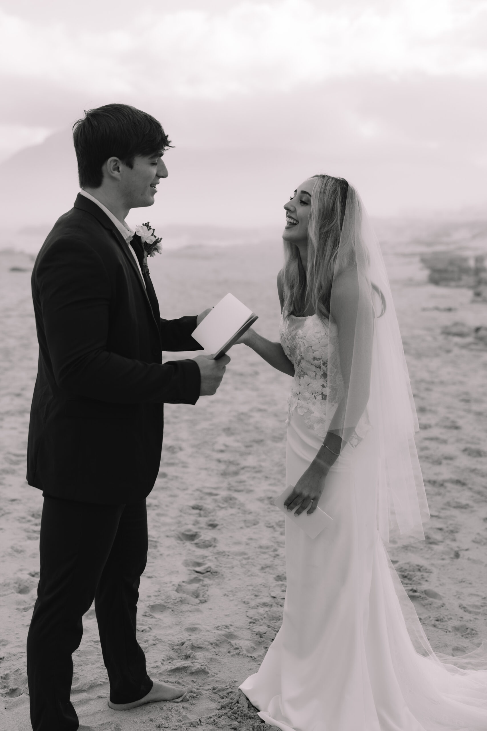 Couple exchanging vows on a quiet beach, one of the most meaningful cape town wedding locations.