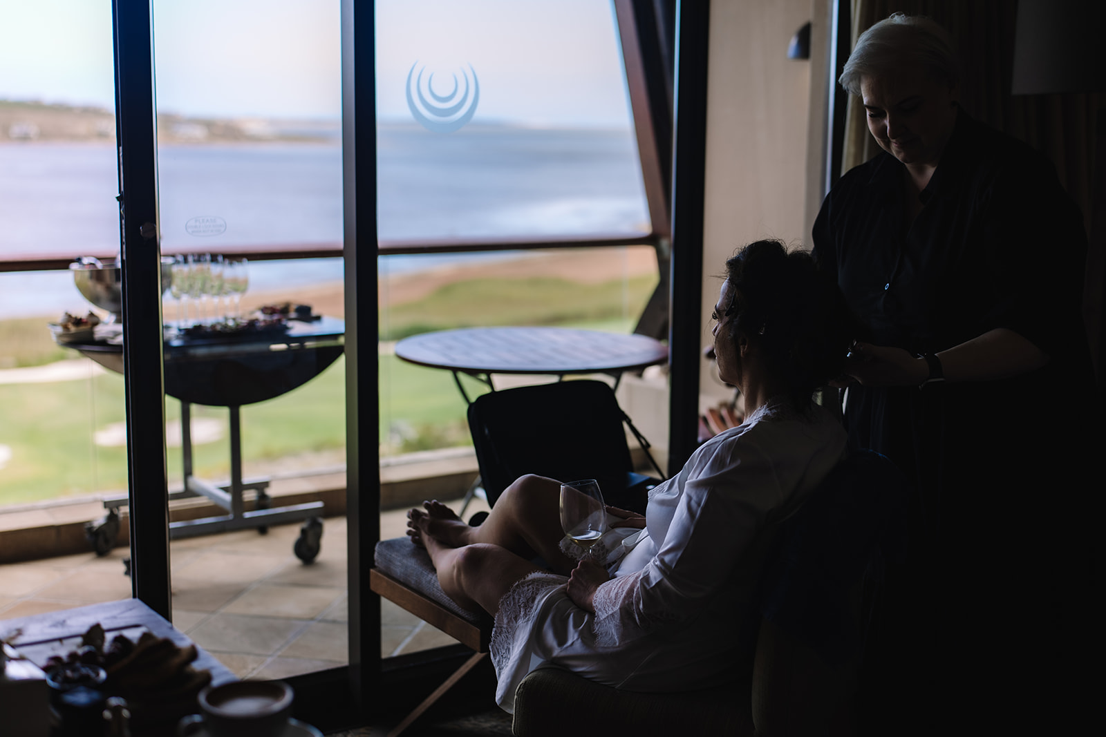 Bride getting ready with ocean views before her South Africa elopement