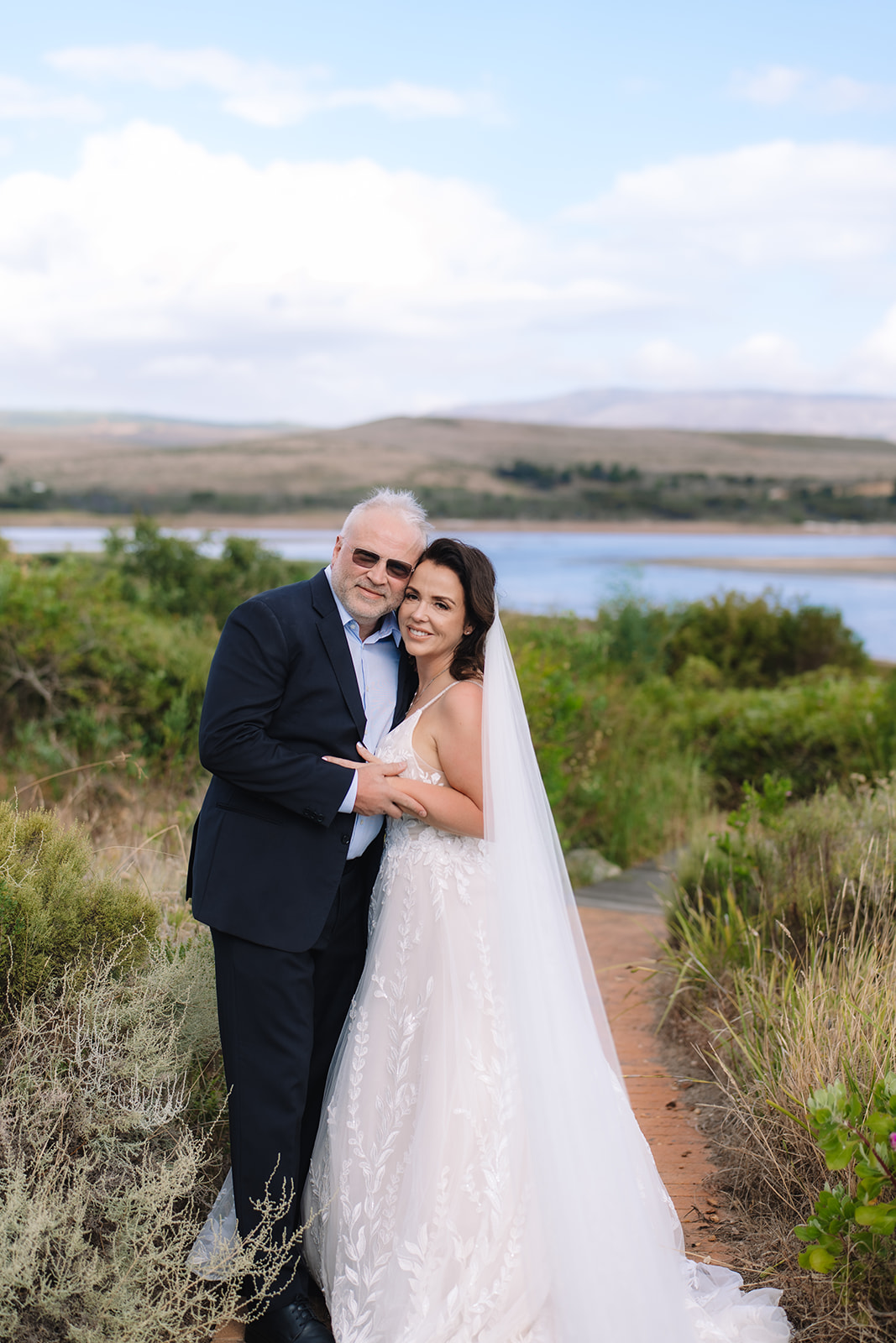 Couple embracing during their stony point nature reserve wedding in Betty’s Bay