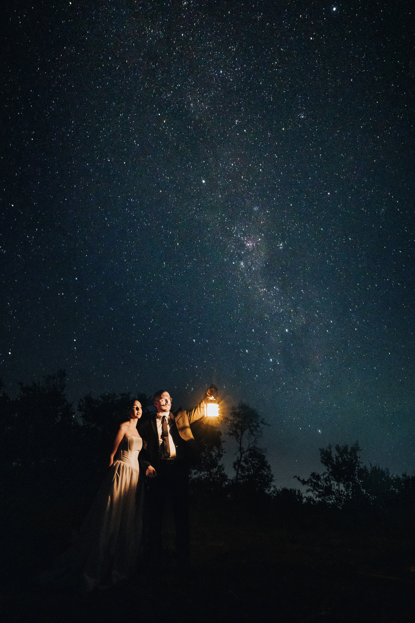 Cassidy and Charlie photographed beneath the Milky Way after their Sabi Sands safari elopement