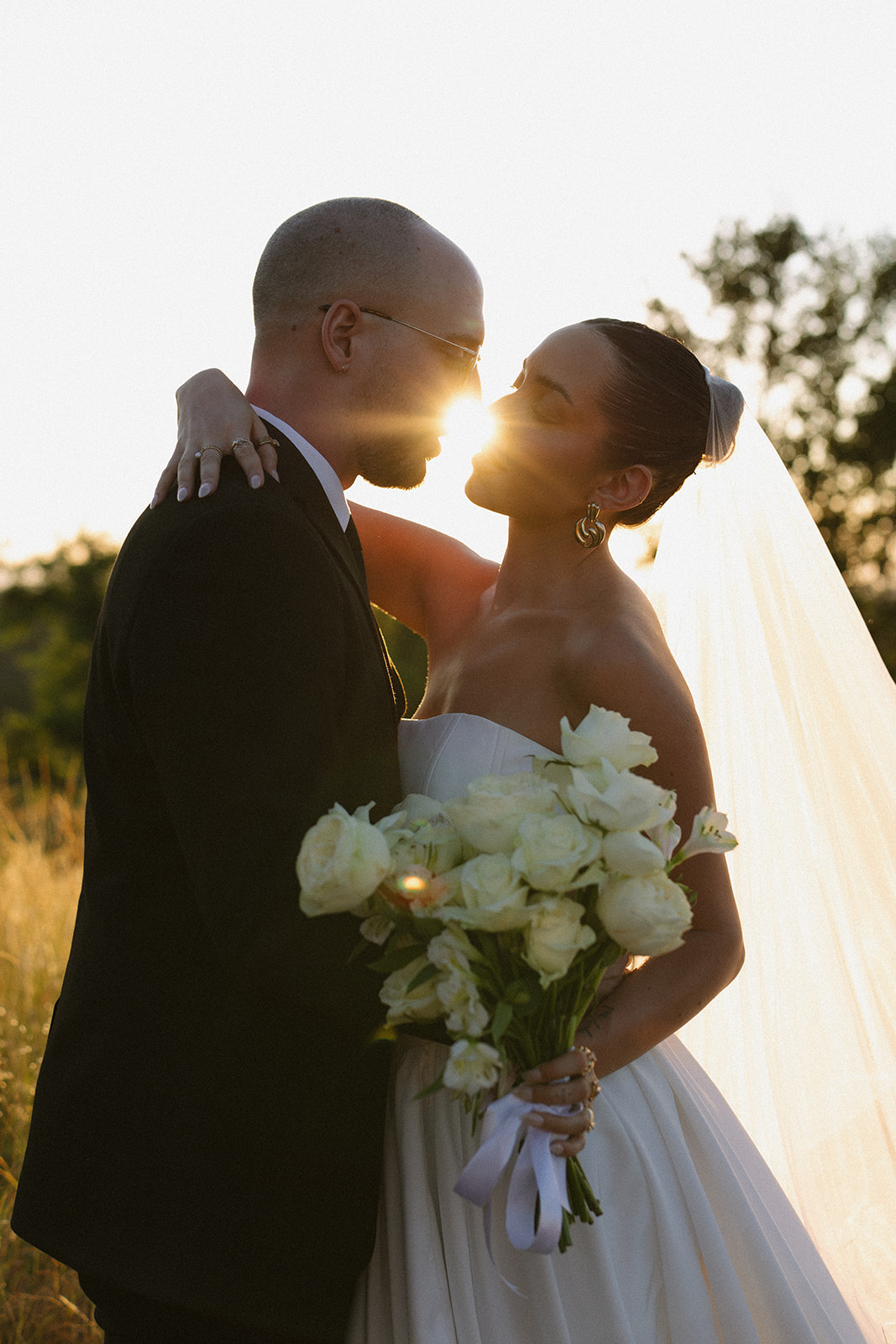 Bride and groom sharing a sunset kiss during their decision to elope in South Africa
