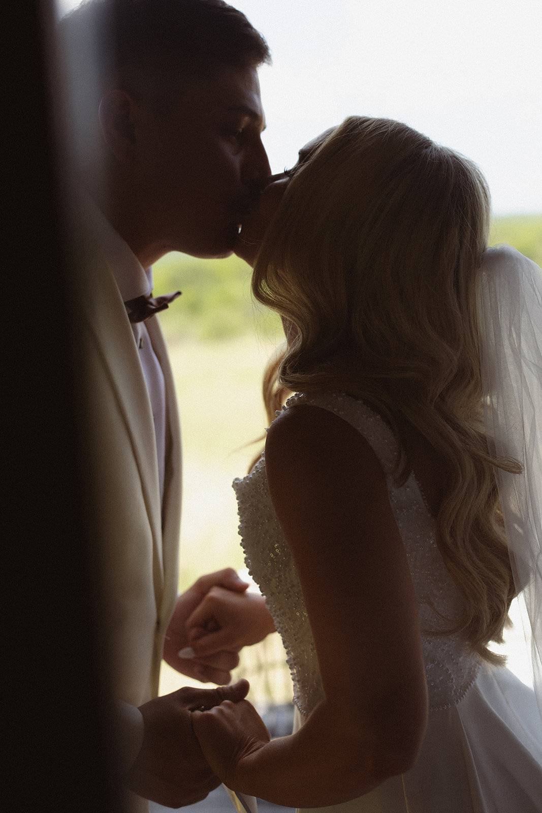 Bride and groom sharing their first kiss during intimate ceremony at a safari wedding in South Africa