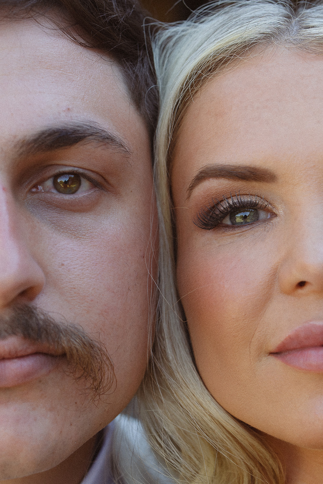 Close-up portrait of bride and groom showing natural makeup and details on their wedding day
